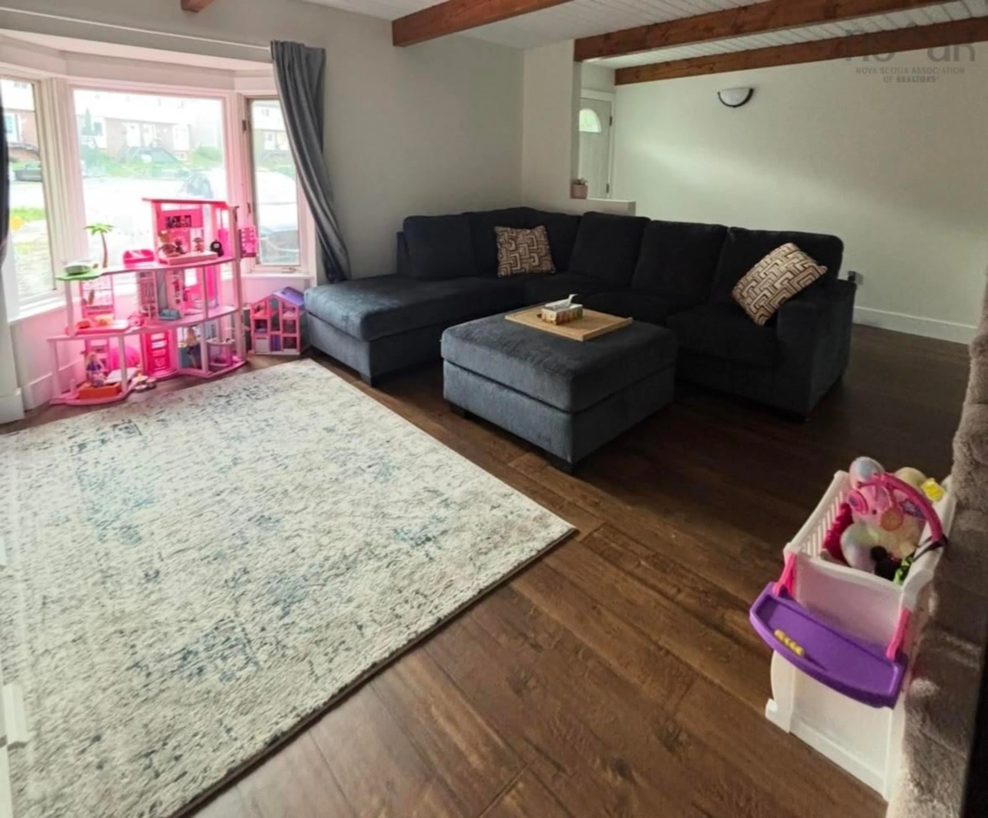 Living room with furniture, wood/laminate floor for 74 Matador Crt, Halifax Regional Municipality Nova Scotia B4C 3G9