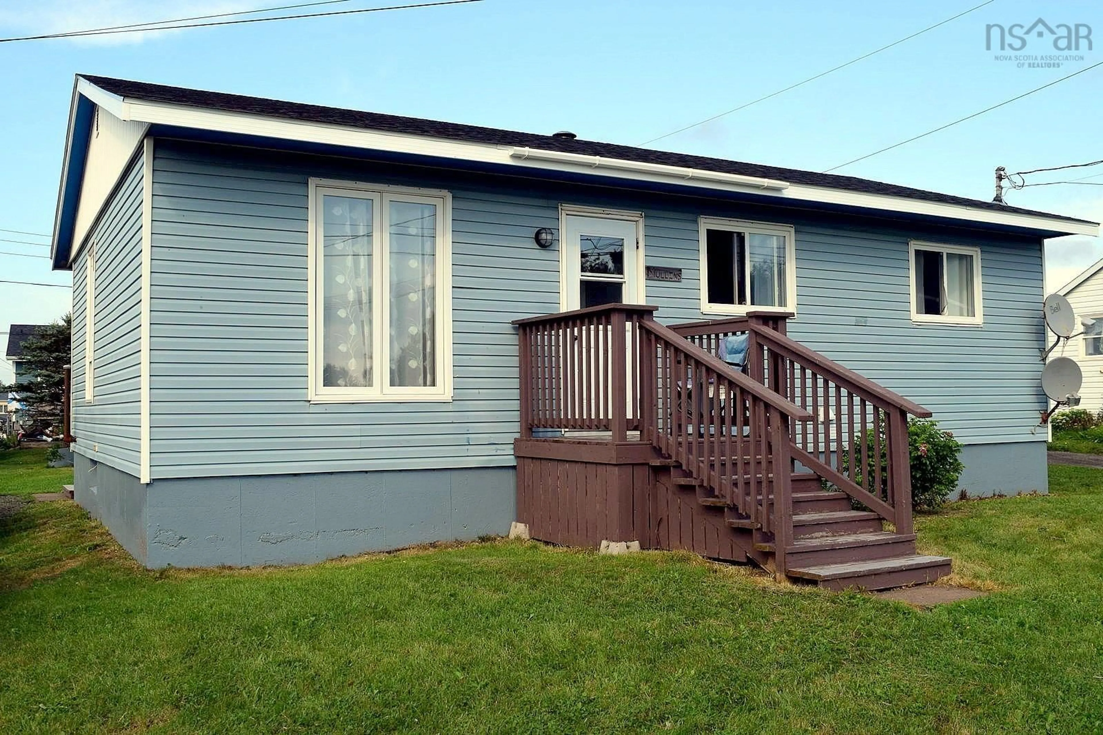 Home with vinyl exterior material, street for 18 River St, Inverness Nova Scotia B0E 1N0