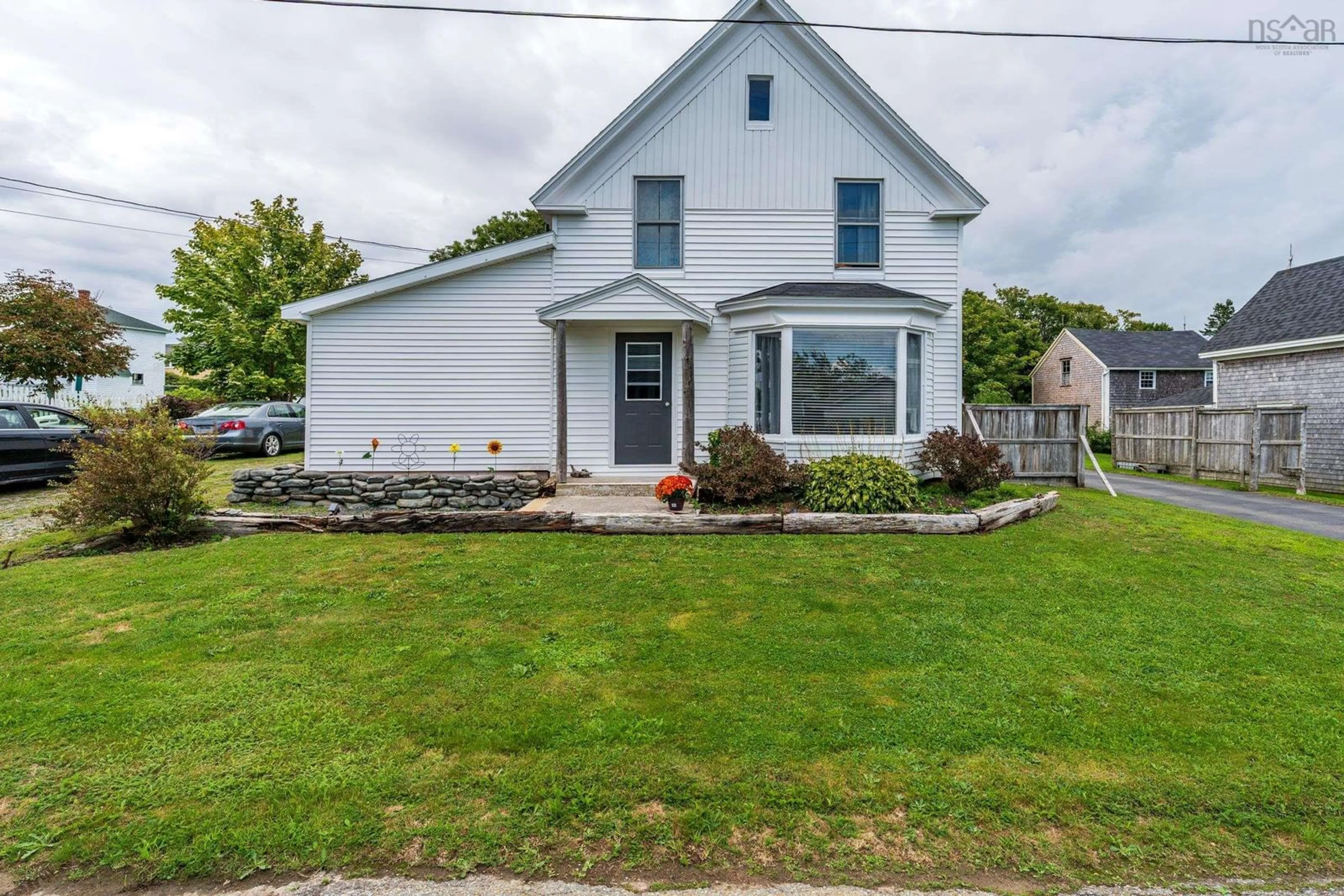 Home with vinyl exterior material, street for 21 Charles St, Port Maitland Nova Scotia B5A 5R8
