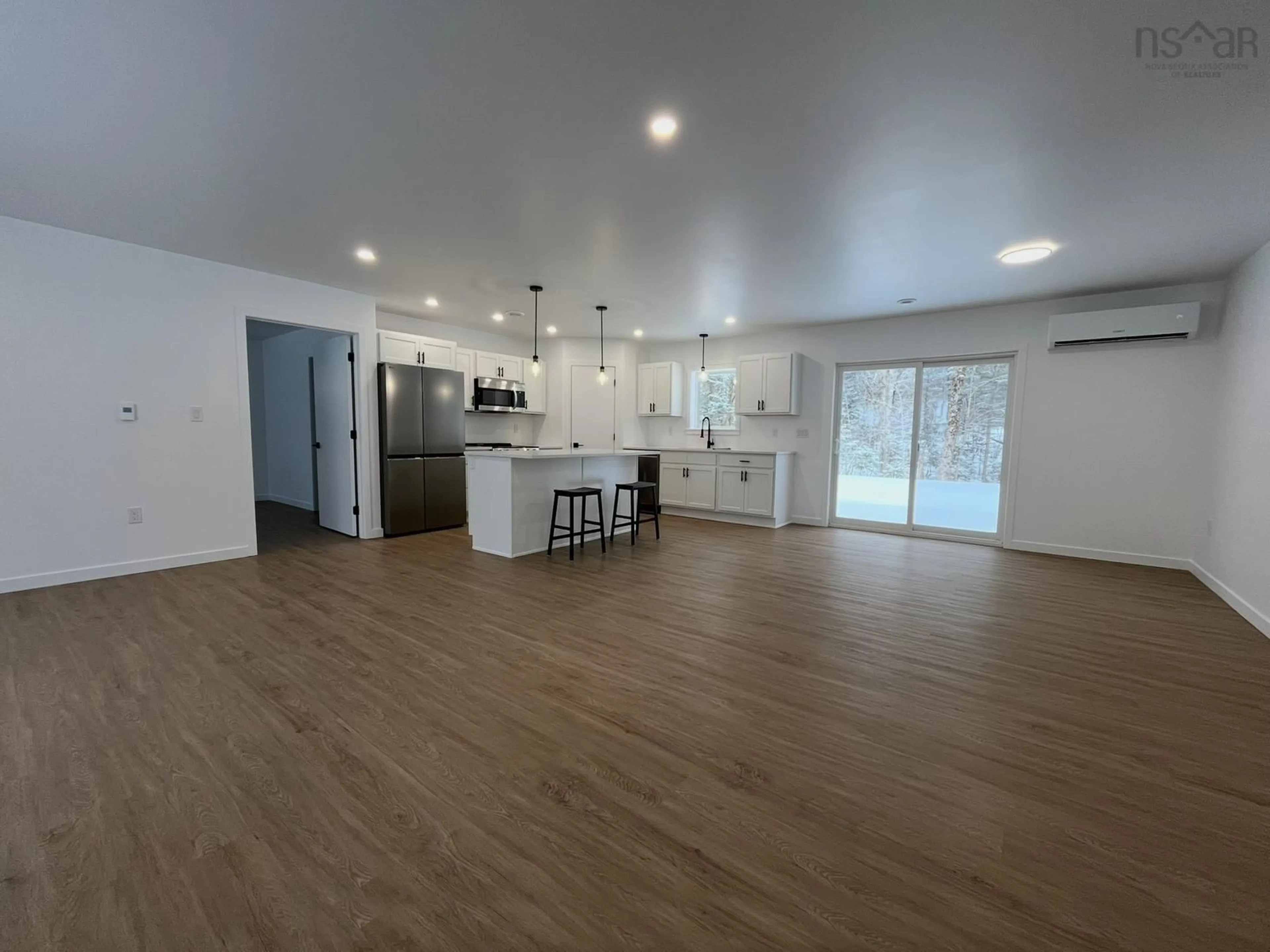 Open concept kitchen, wood/laminate floor for 402 Mullock Rd, Rhodes Corner Nova Scotia B4V 5N5