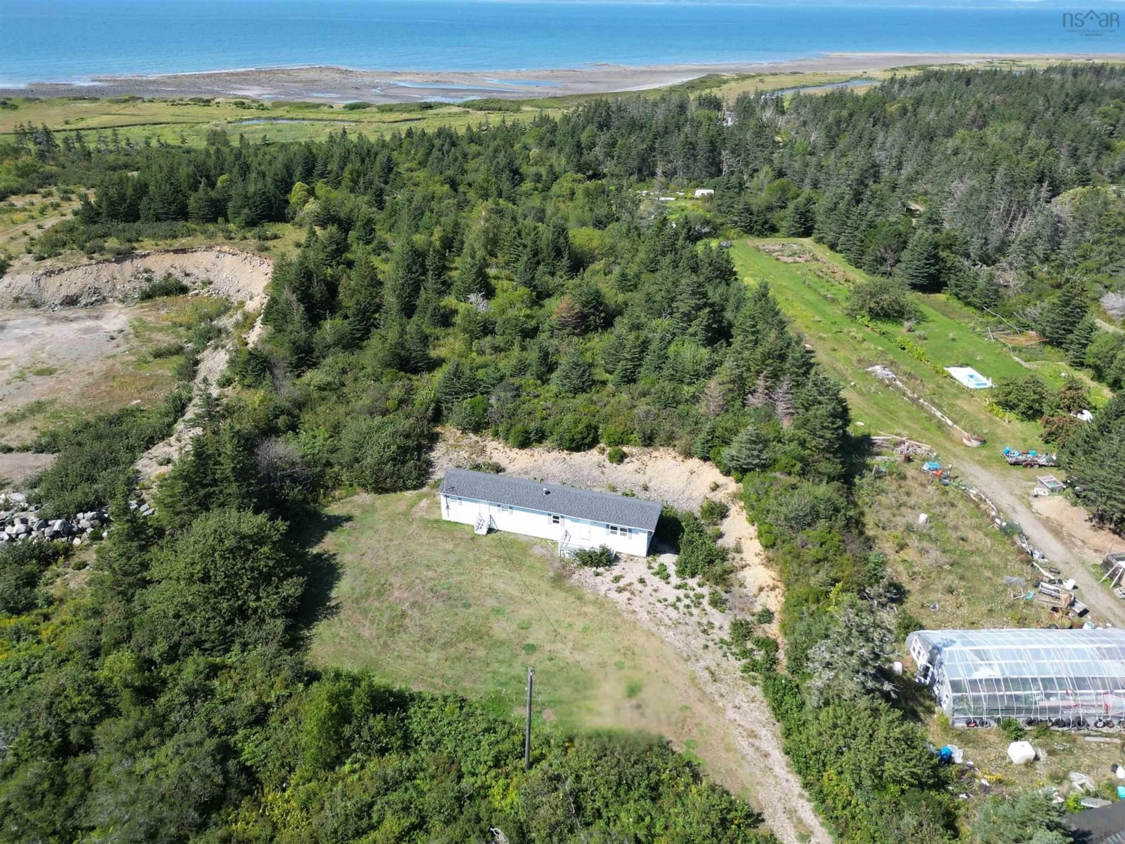 A pic from outside/outdoor area/front of a property/back of a property/a pic from drone, water/lake/river/ocean view for 2183 Highway 1, Grosses Coques Nova Scotia B0W 1M0
