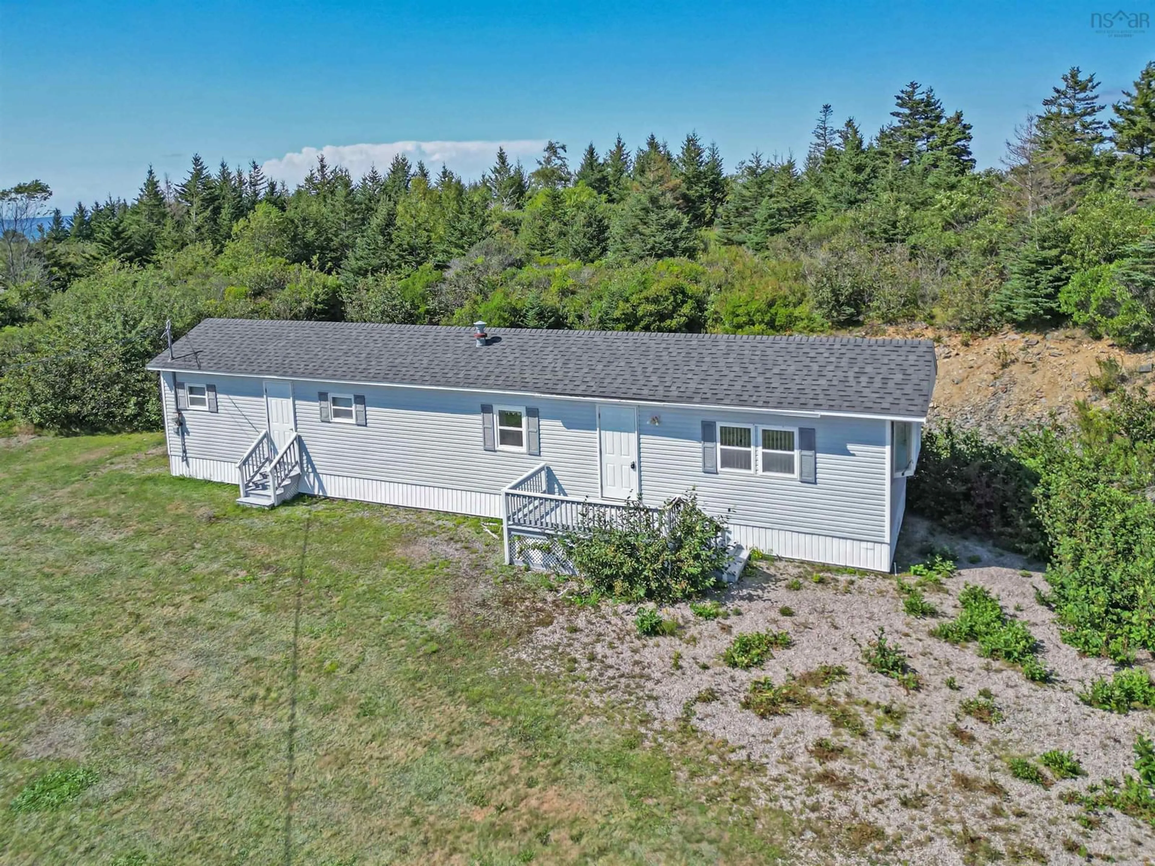 A pic from outside/outdoor area/front of a property/back of a property/a pic from drone, unknown for 2183 Highway 1, Grosses Coques Nova Scotia B0W 1M0