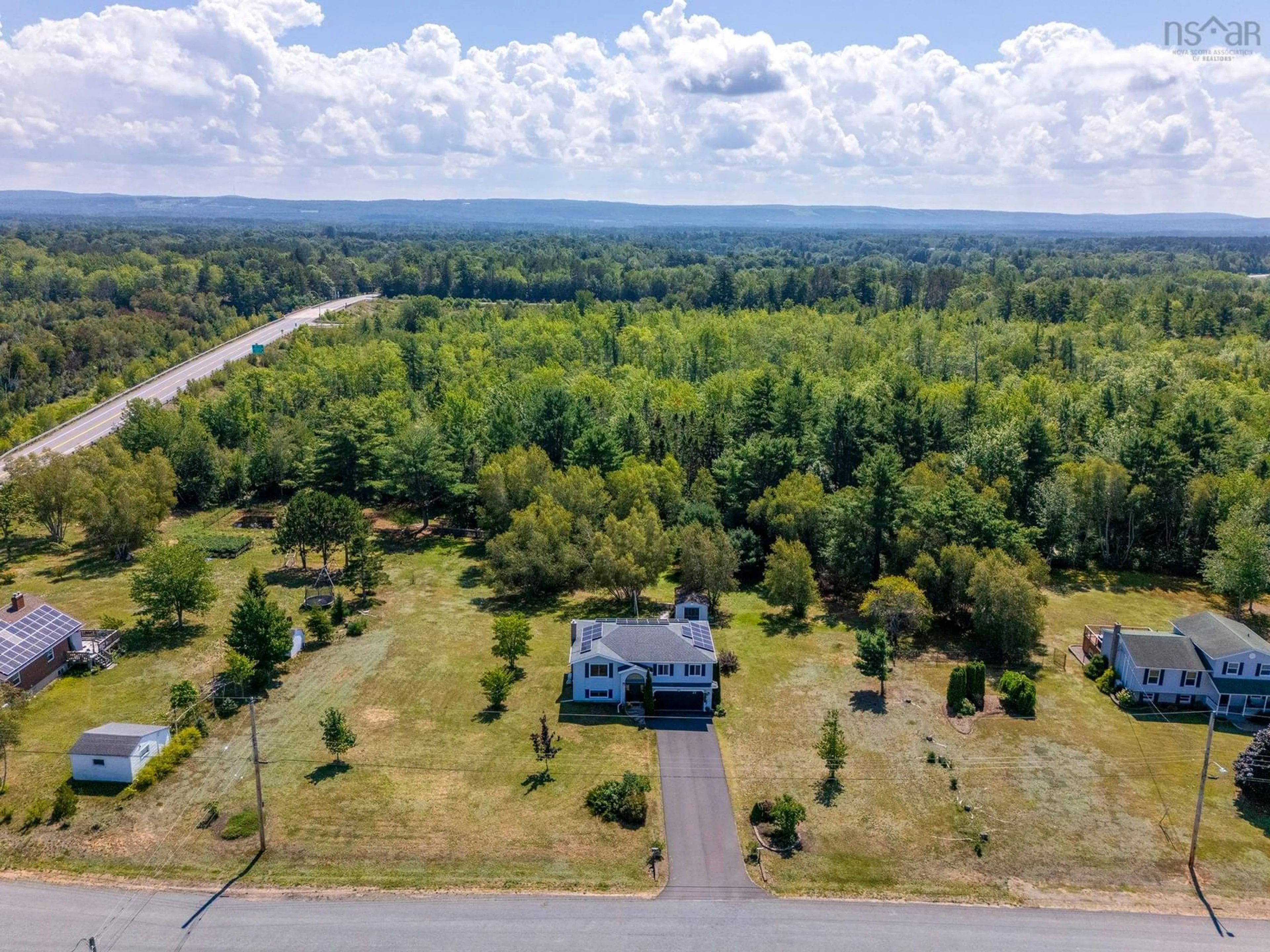 A pic from outside/outdoor area/front of a property/back of a property/a pic from drone, forest/trees view for 23 Dahlgren Cres, North Kingston Nova Scotia B0P 1R0
