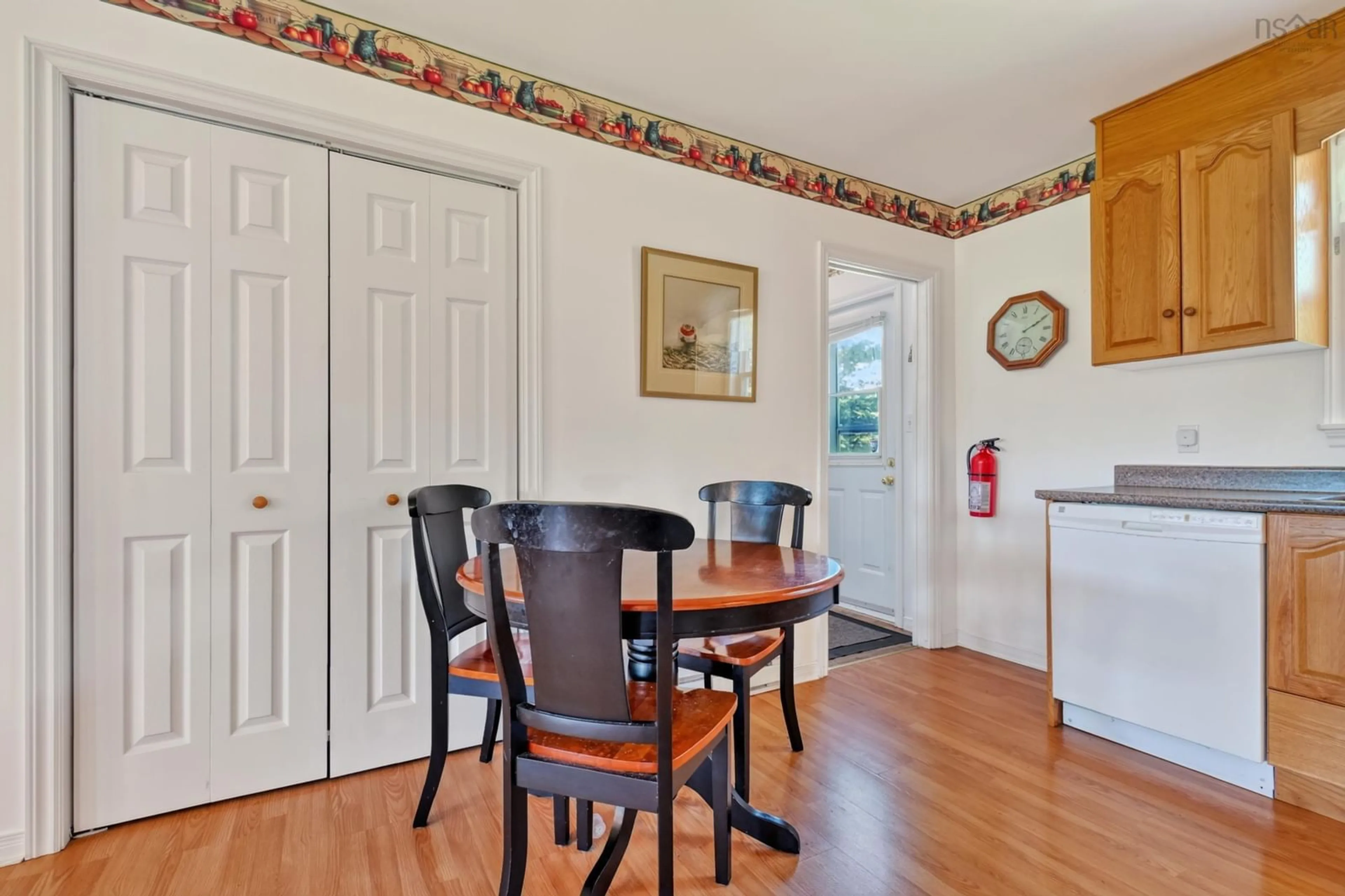 Dining room, wood/laminate floor for 70 Little Harbour Rd, Lower L'Ardoise Nova Scotia B0E 1W0