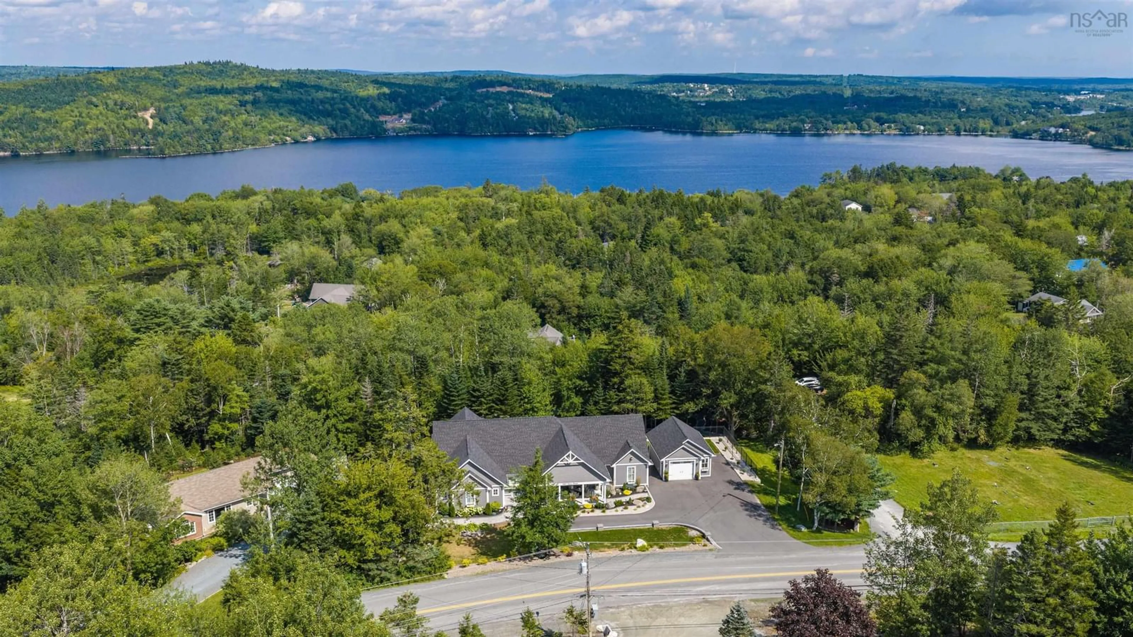 A pic from outside/outdoor area/front of a property/back of a property/a pic from drone, water/lake/river/ocean view for 389 Myra Rd, Porters Lake Nova Scotia B3E 1G2