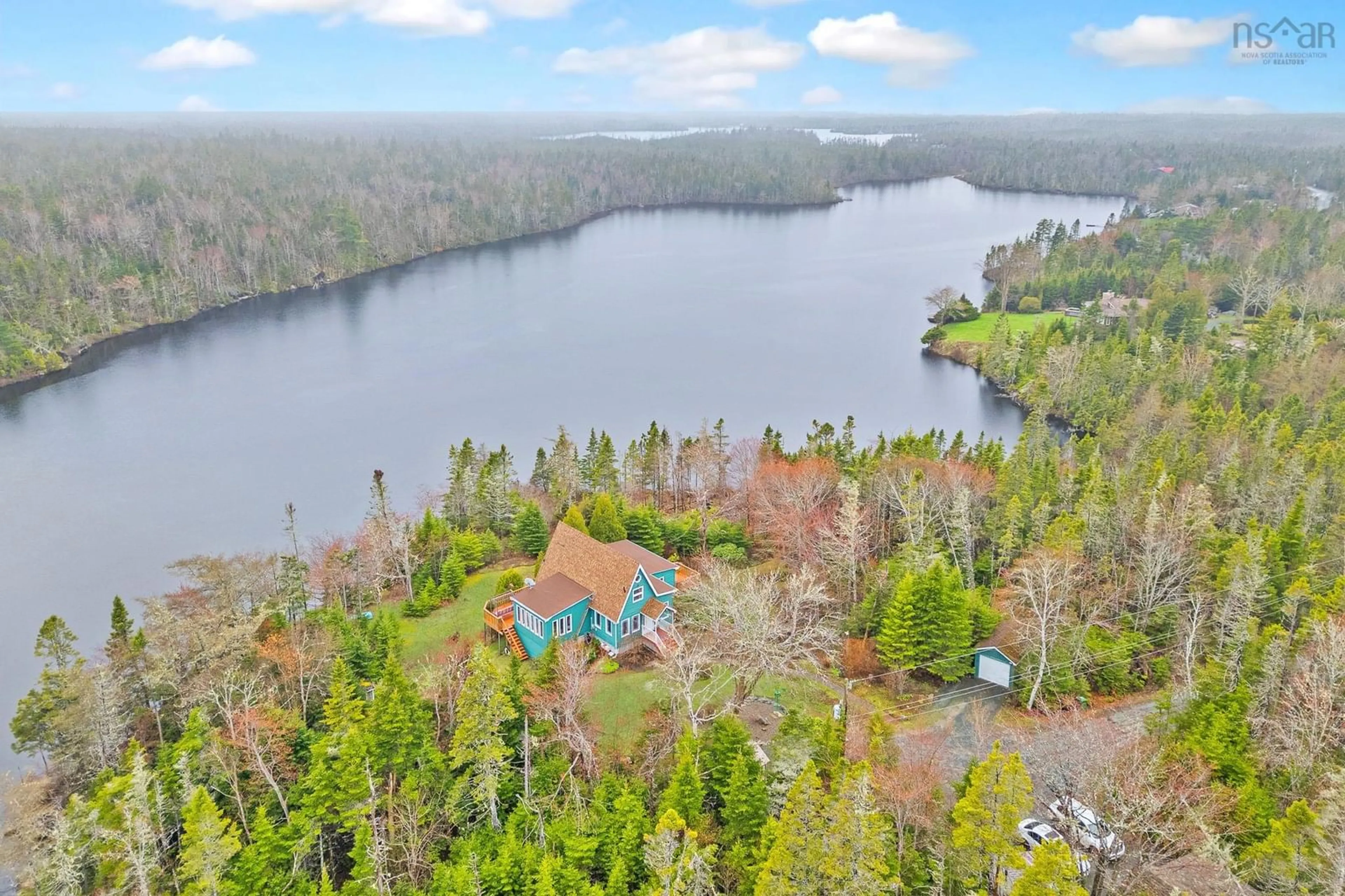 A pic from outside/outdoor area/front of a property/back of a property/a pic from drone, water/lake/river/ocean view for 11028 Highway 7, Lake Charlotte Nova Scotia B0J 2L0