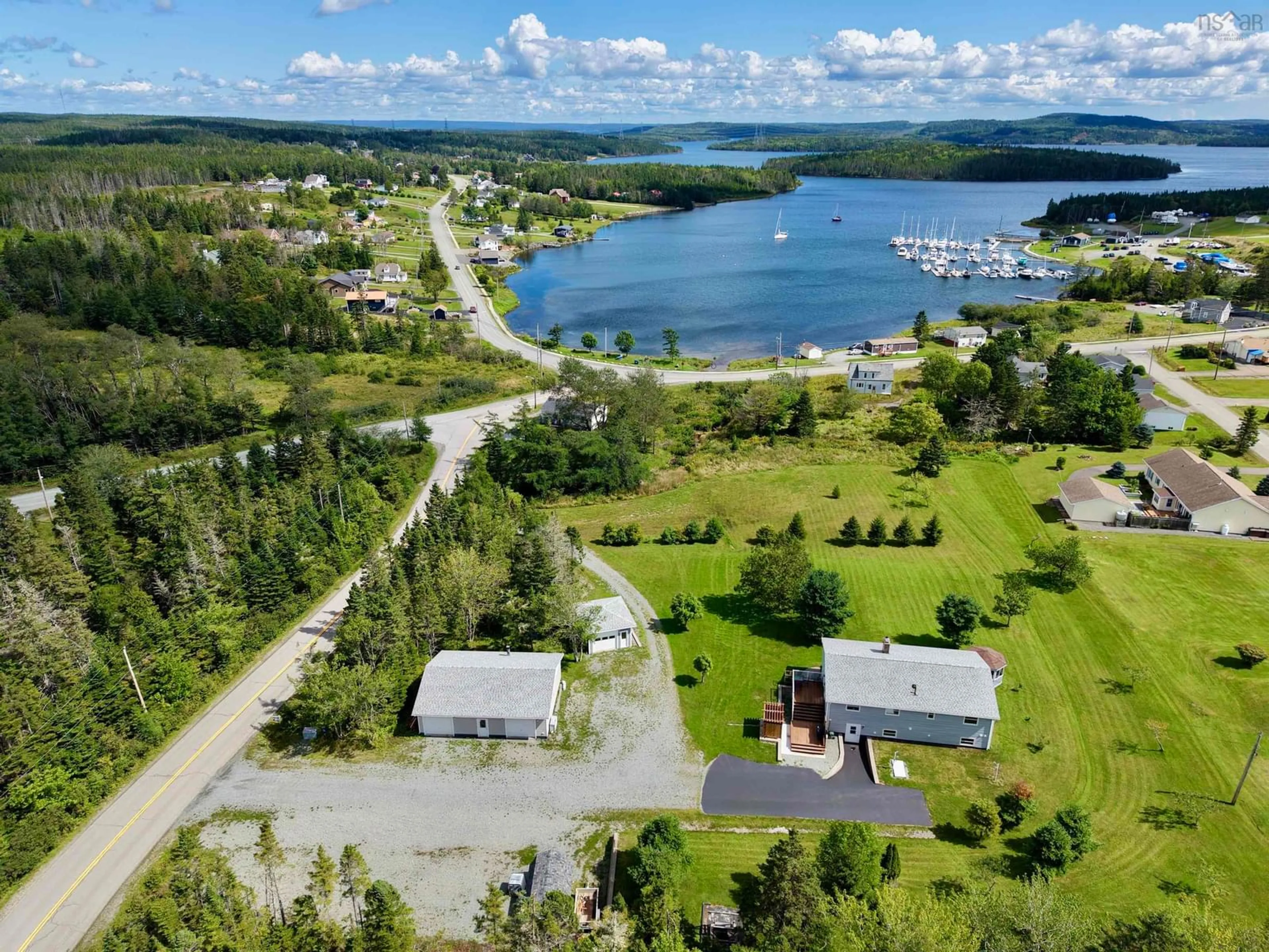 A pic from outside/outdoor area/front of a property/back of a property/a pic from drone, water/lake/river/ocean view for 110 De Raymond St., St. Peter's Nova Scotia B0E 3B0