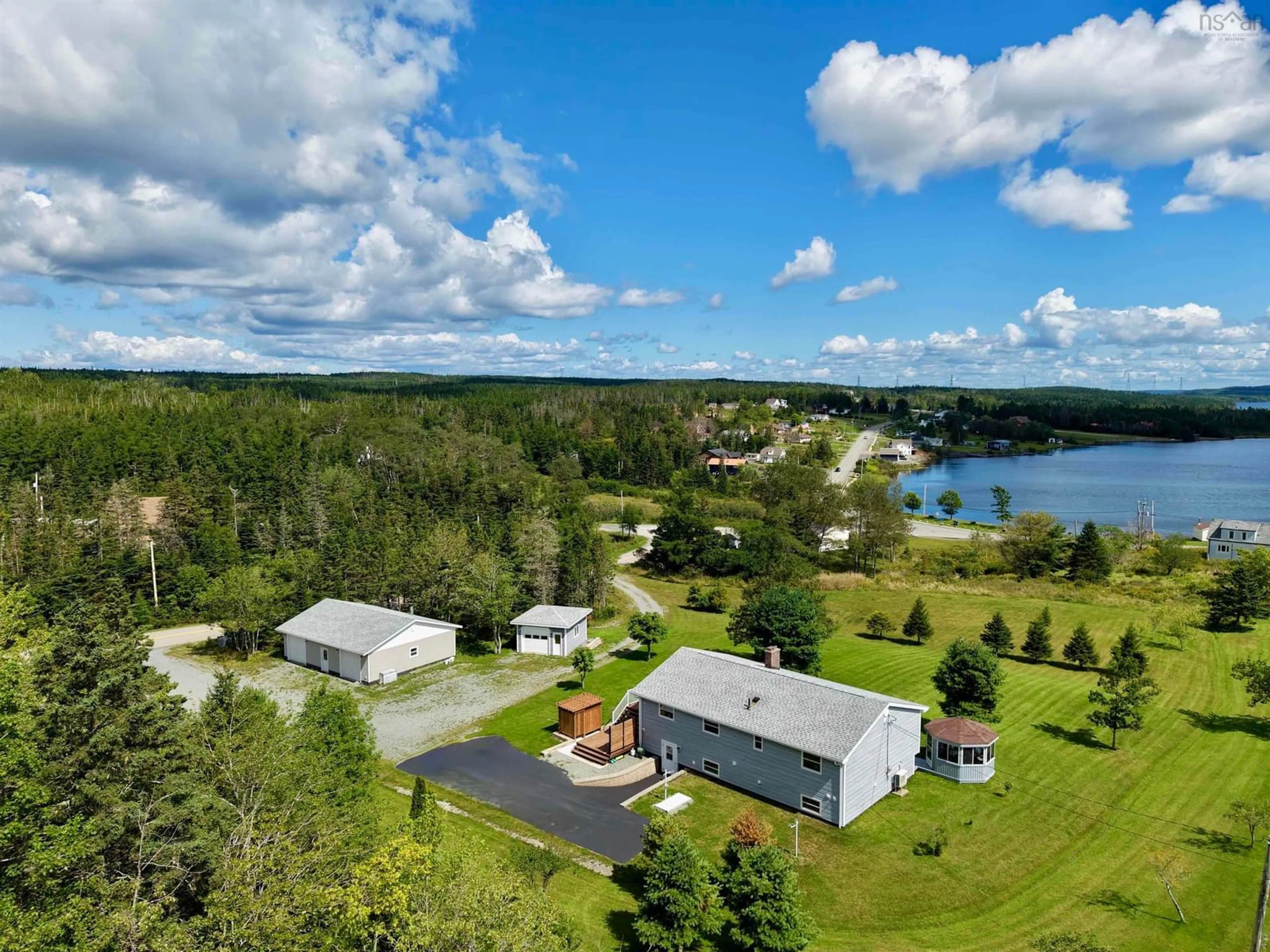 A pic from outside/outdoor area/front of a property/back of a property/a pic from drone, water/lake/river/ocean view for 110 De Raymond St., St. Peter's Nova Scotia B0E 3B0
