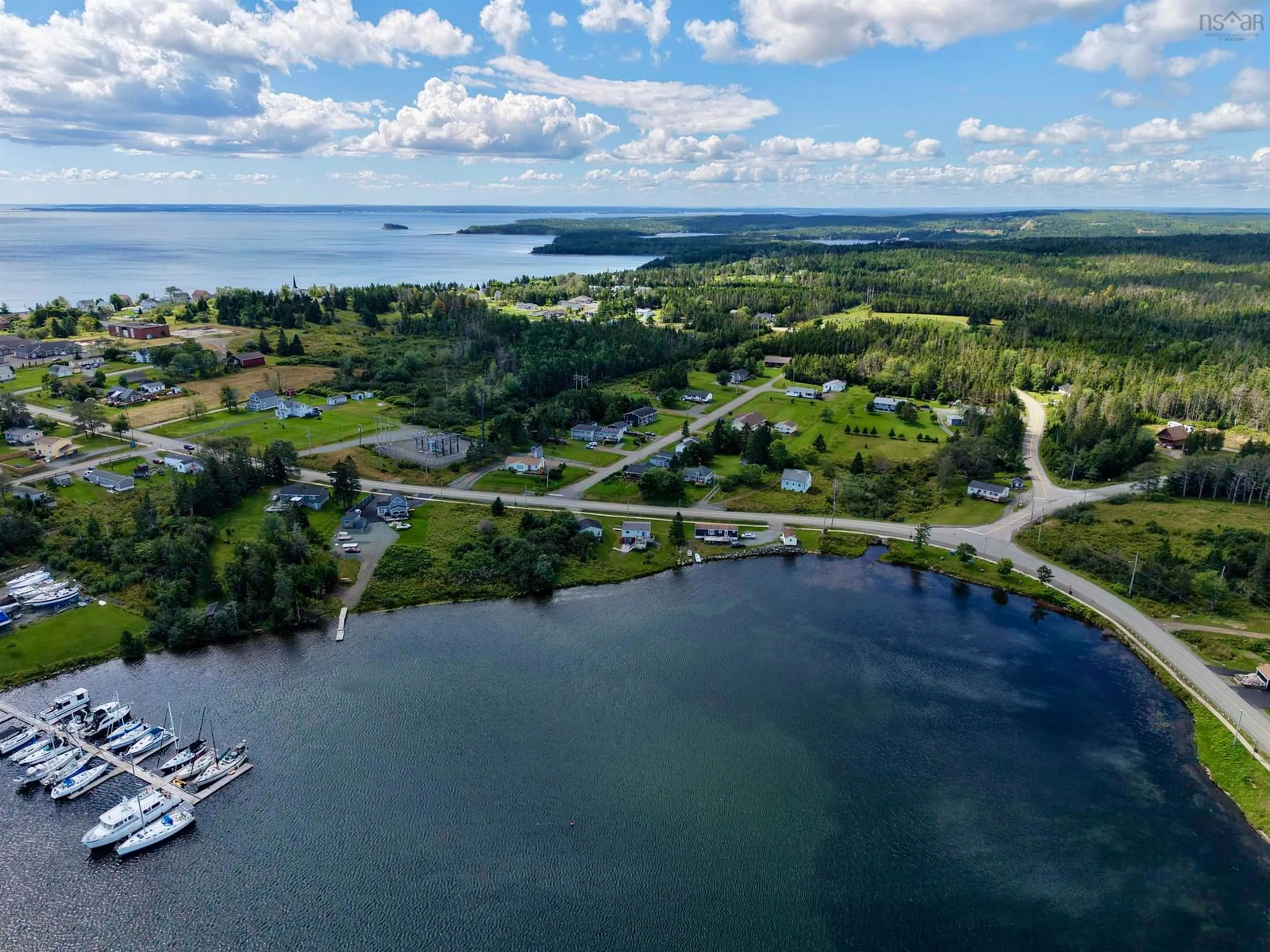 A pic from outside/outdoor area/front of a property/back of a property/a pic from drone, water/lake/river/ocean view for 110 De Raymond St., St. Peter's Nova Scotia B0E 3B0
