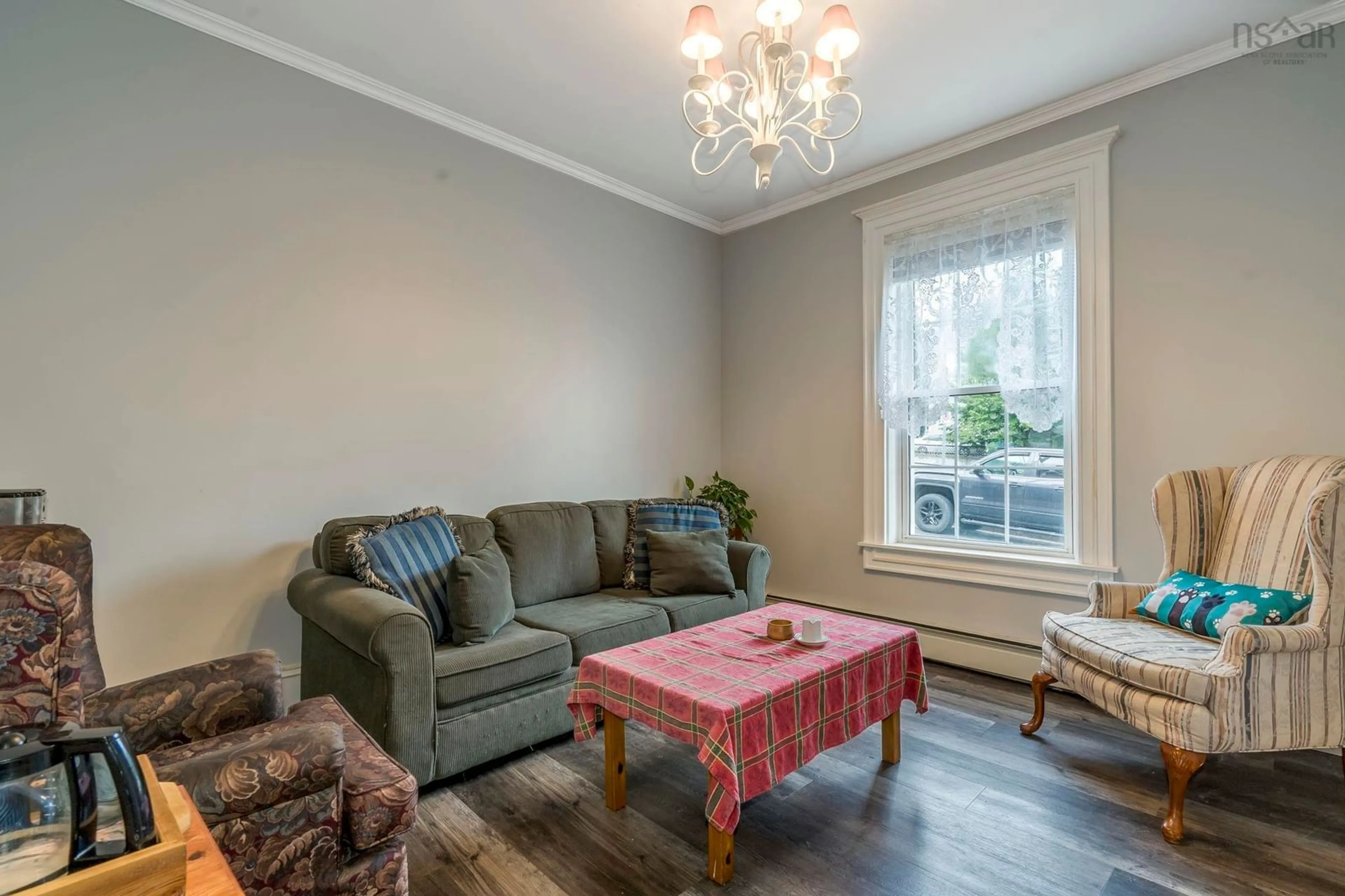 Living room with furniture, wood/laminate floor for 20 Gray St, Windsor Nova Scotia B0N 2T0