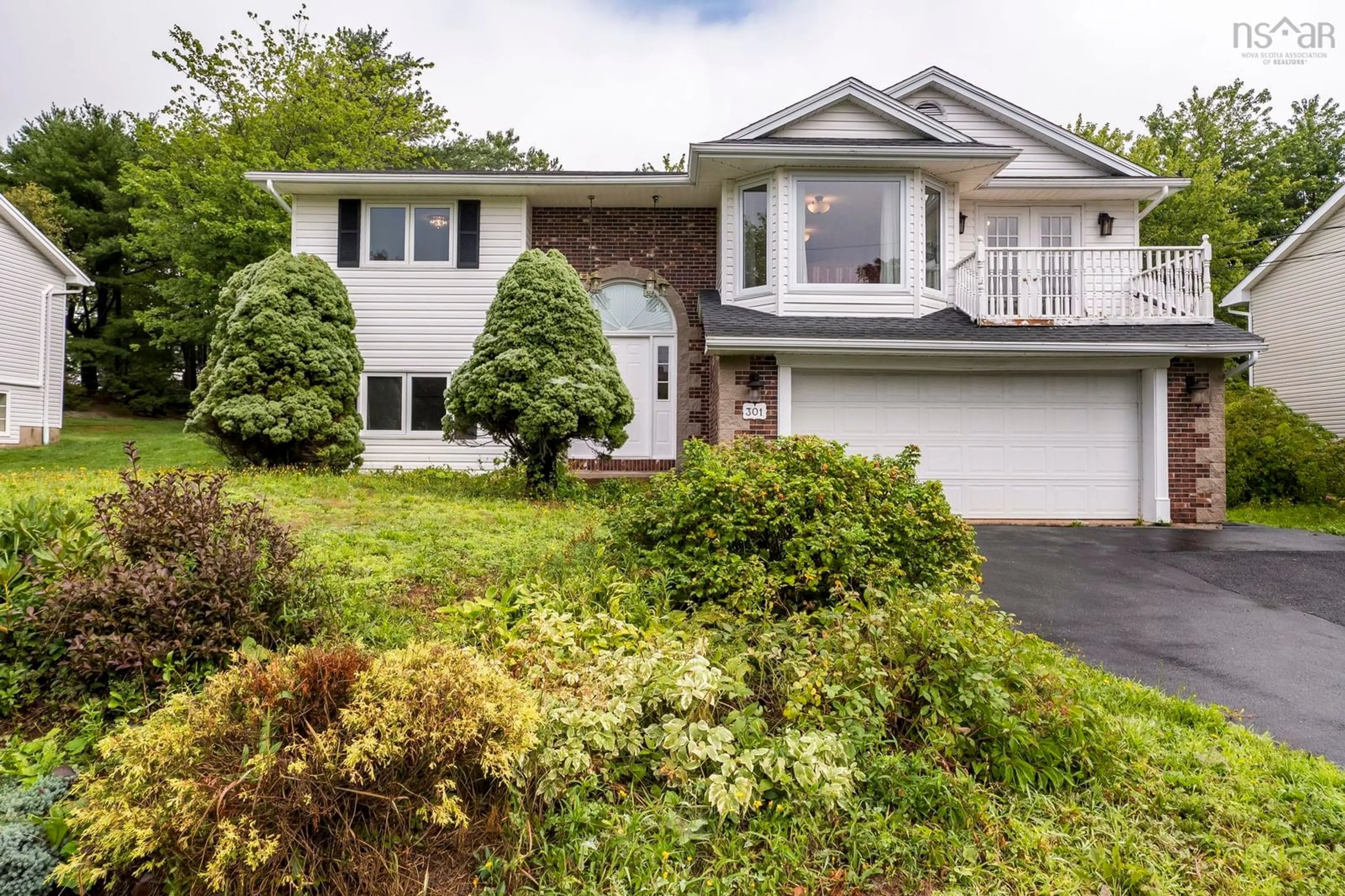 Home with vinyl exterior material, street for 301 Basinview Dr, Bedford Nova Scotia B4A 3X8
