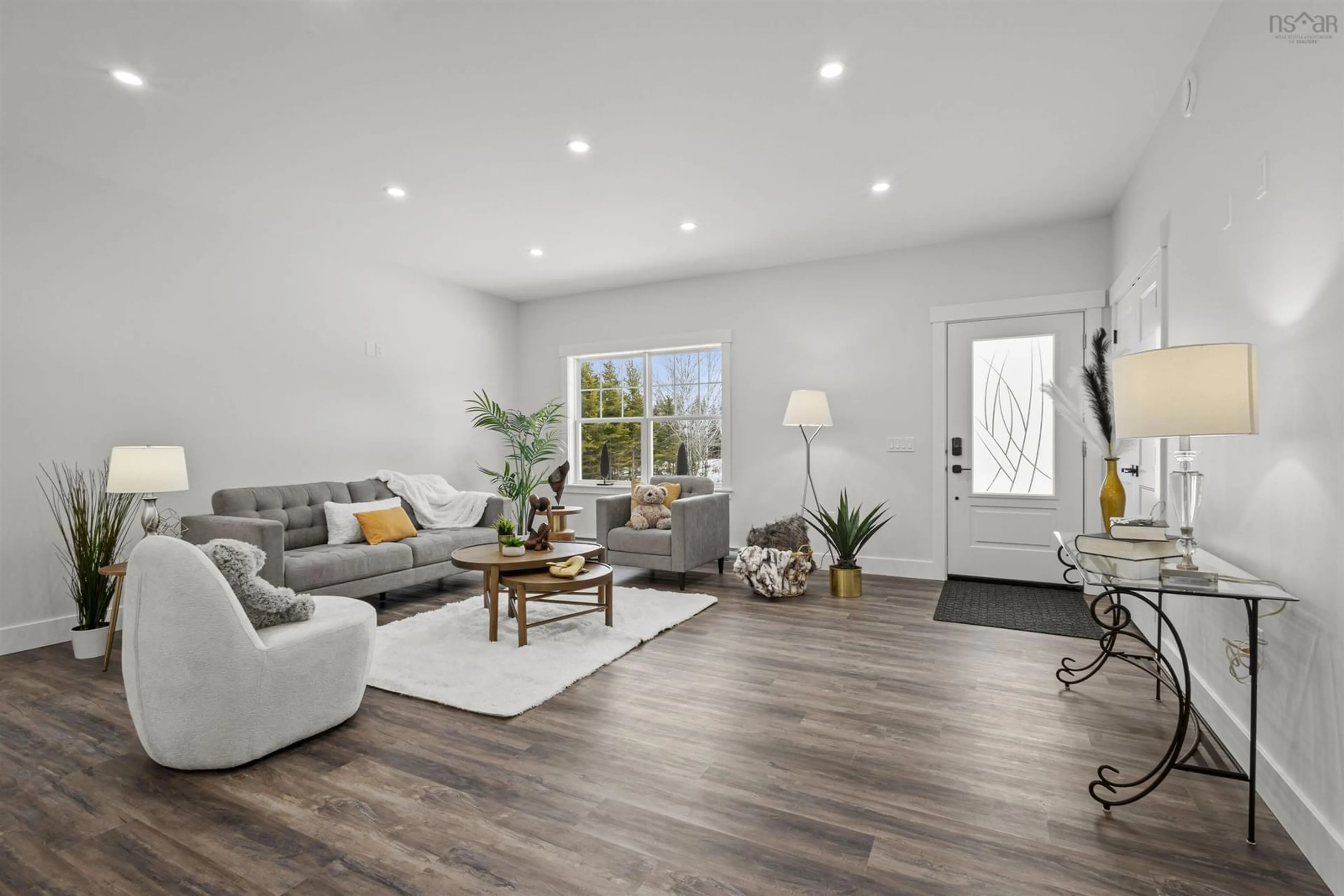 Living room with furniture, wood/laminate floor for Loon Point Trail #186, East Uniacke Nova Scotia B0N 1Z0