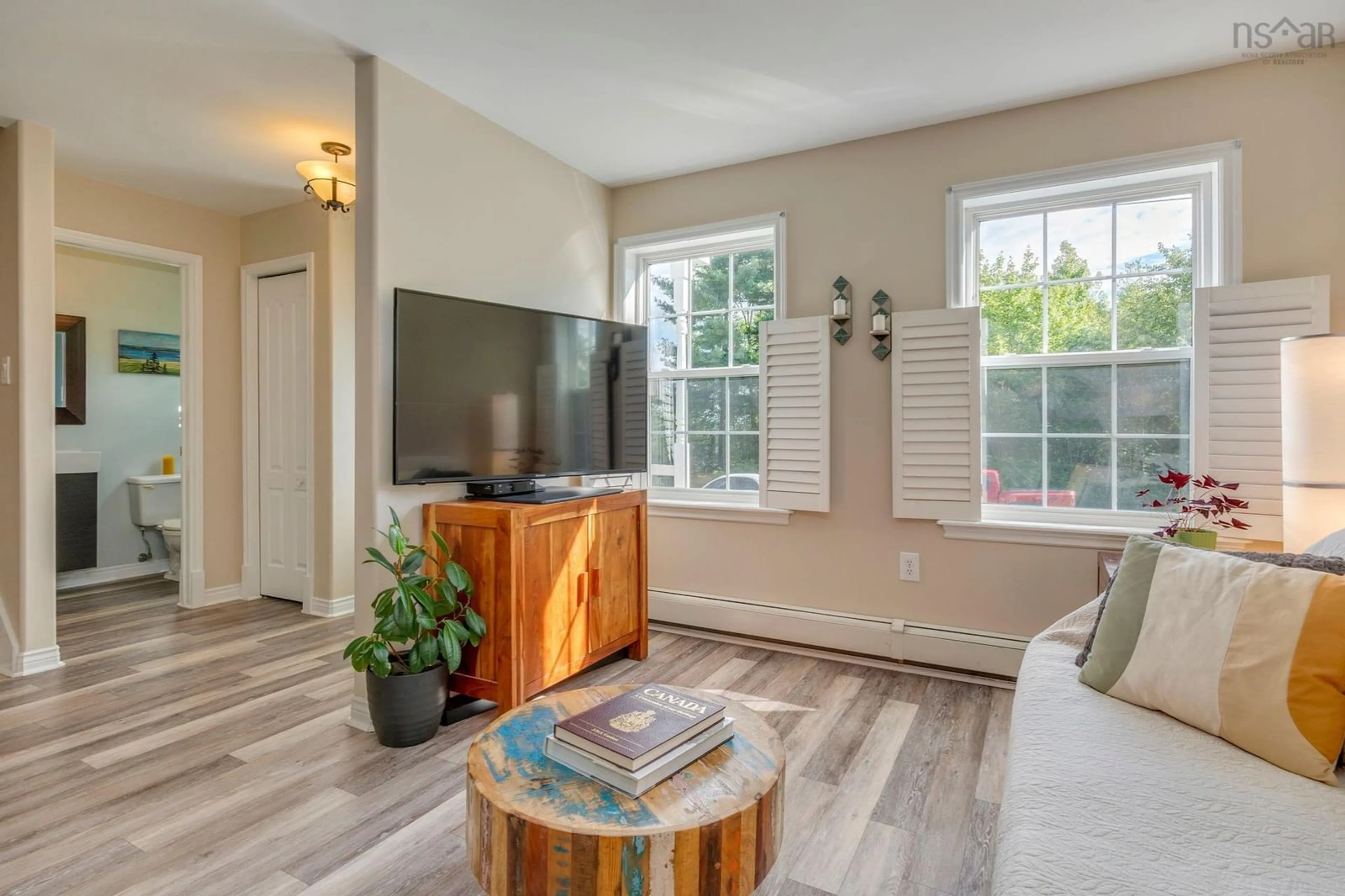 Living room with furniture, wood/laminate floor for 58 Amin St, Bedford Nova Scotia B4A 4B8