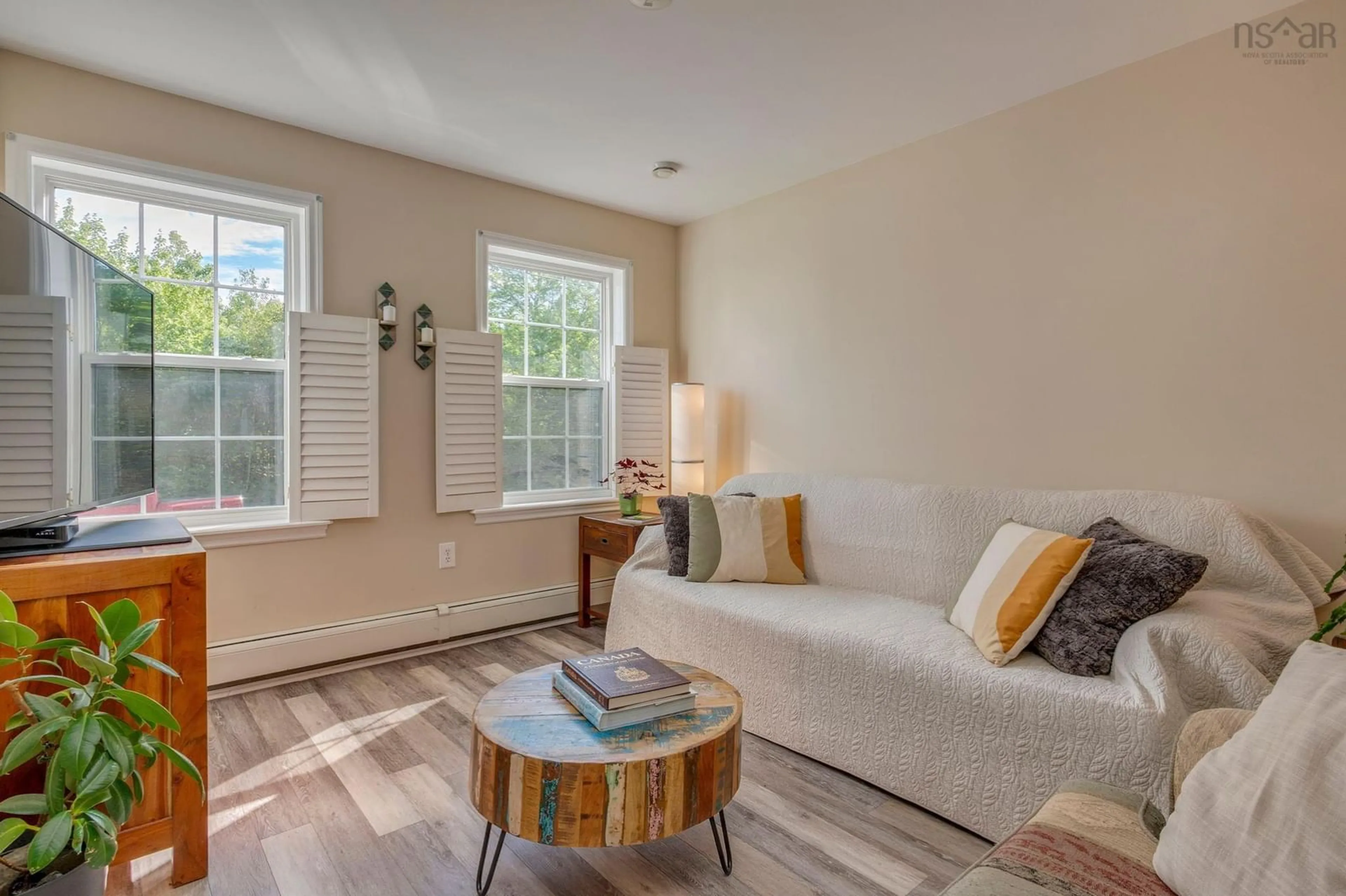 Living room with furniture, wood/laminate floor for 58 Amin St, Bedford Nova Scotia B4A 4B8