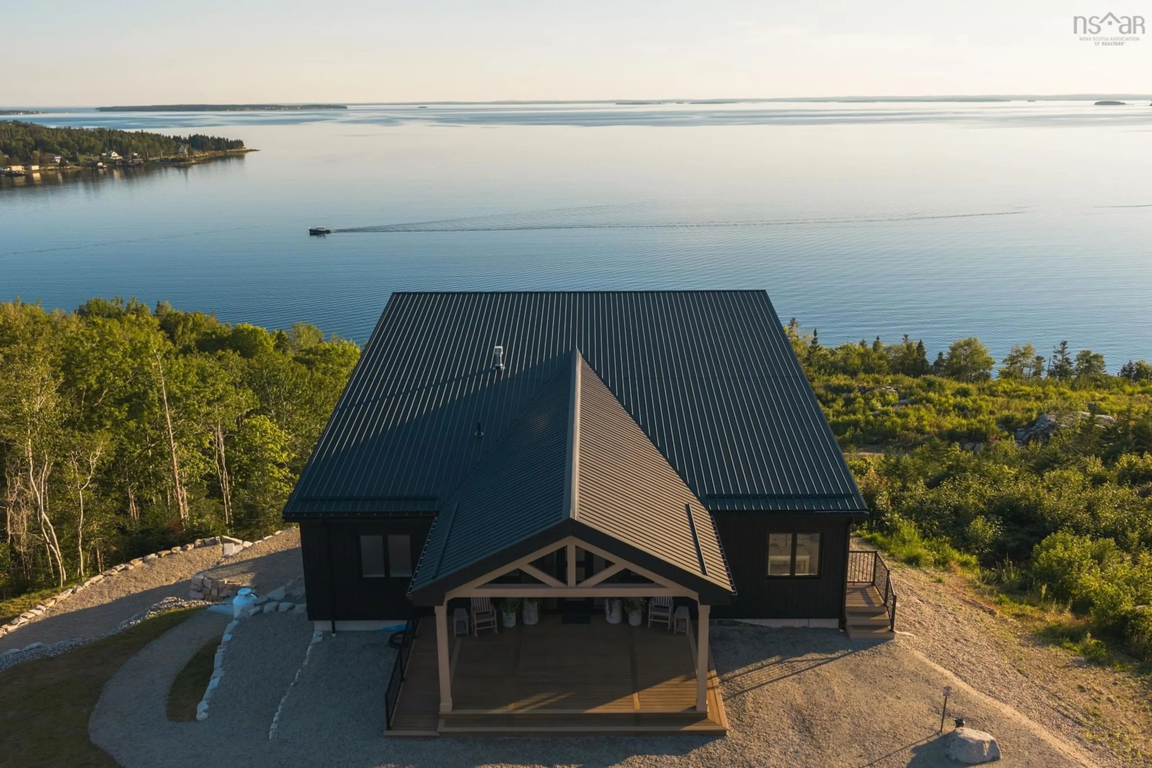 A pic from outside/outdoor area/front of a property/back of a property/a pic from drone, water/lake/river/ocean view for 23 Anchors Way, East River Point Nova Scotia B0J 1T0