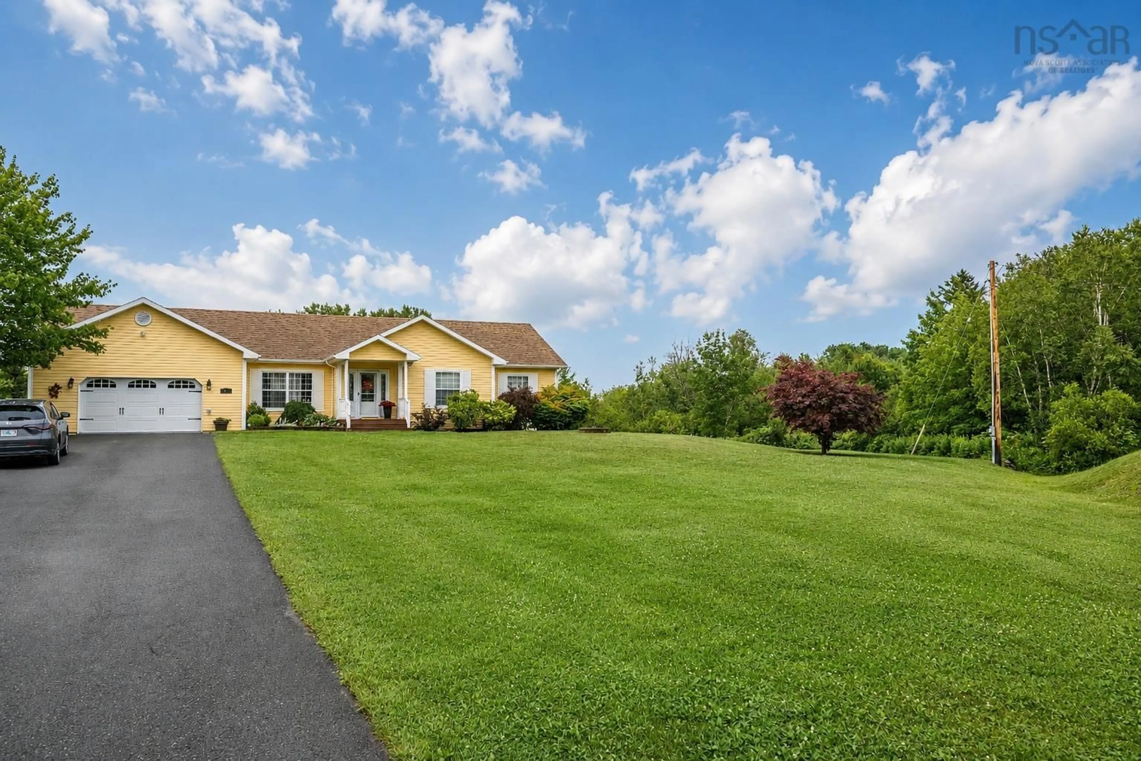 A pic from outside/outdoor area/front of a property/back of a property/a pic from drone, mountain view for 15 Meadowood Crt, Sydney River Nova Scotia B1L 0A2