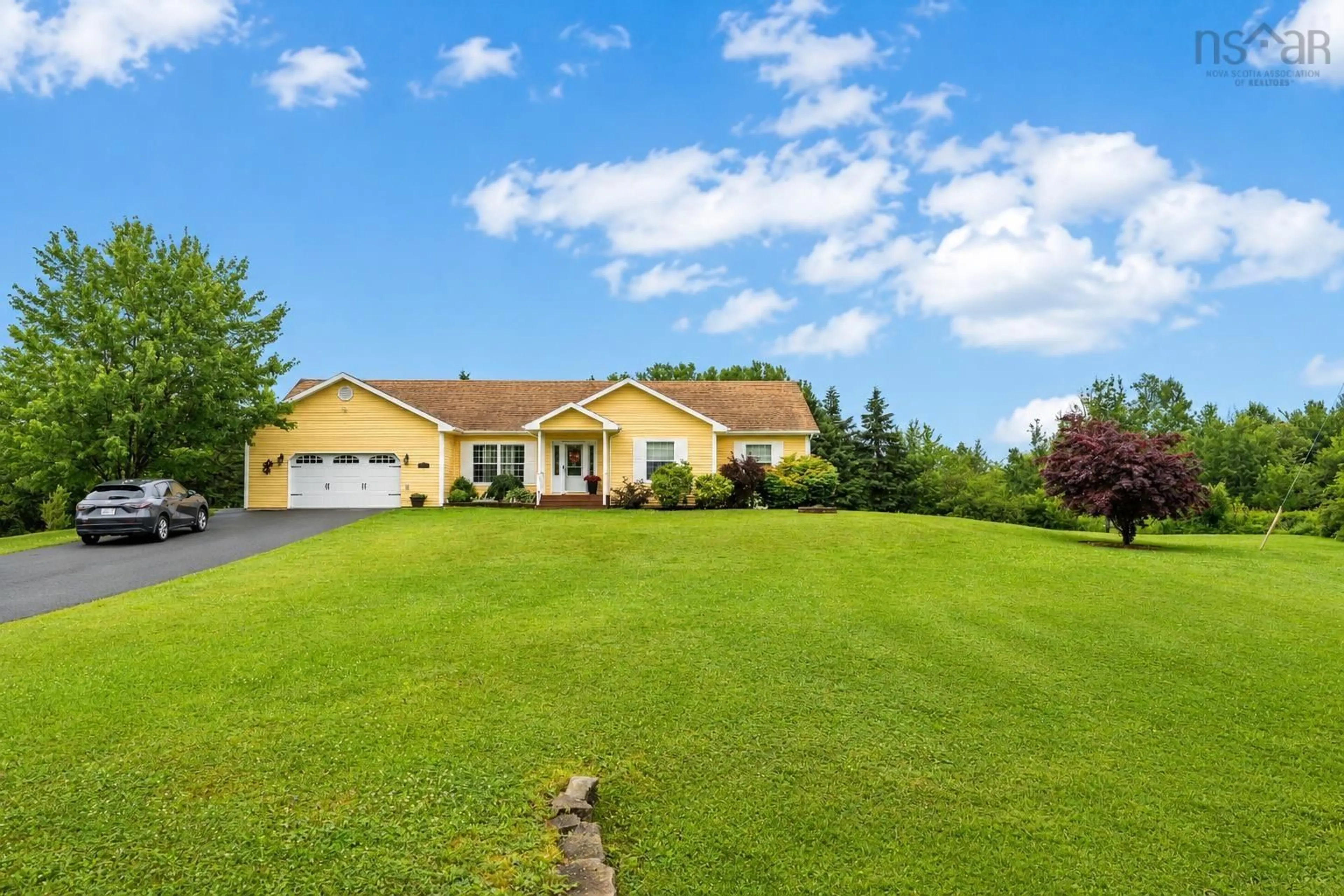 A pic from outside/outdoor area/front of a property/back of a property/a pic from drone, unknown for 15 Meadowood Crt, Sydney River Nova Scotia B1L 0A2