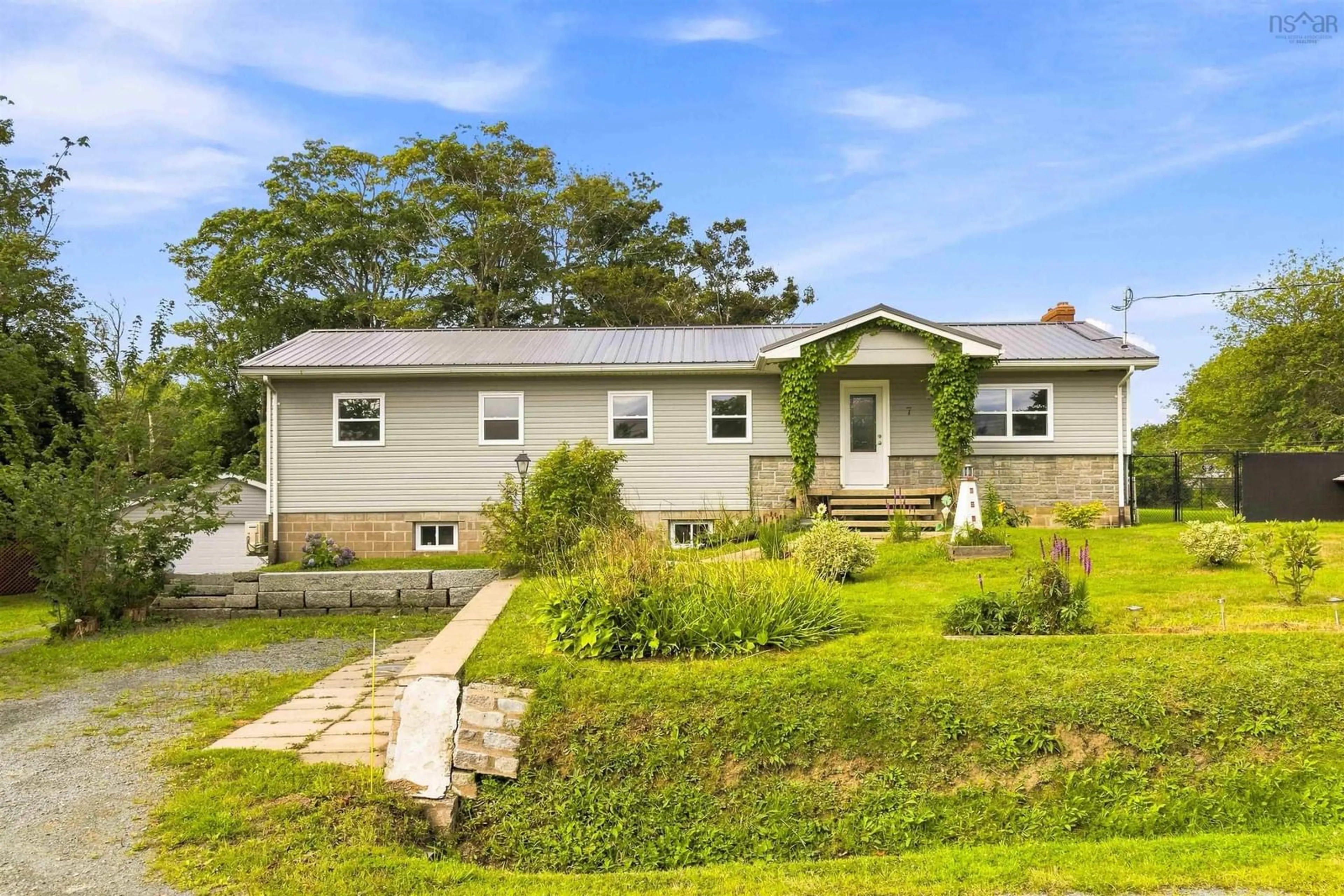 Home with vinyl exterior material, street for 7 Patterson Rd, Cow Bay Nova Scotia B3G 1K4
