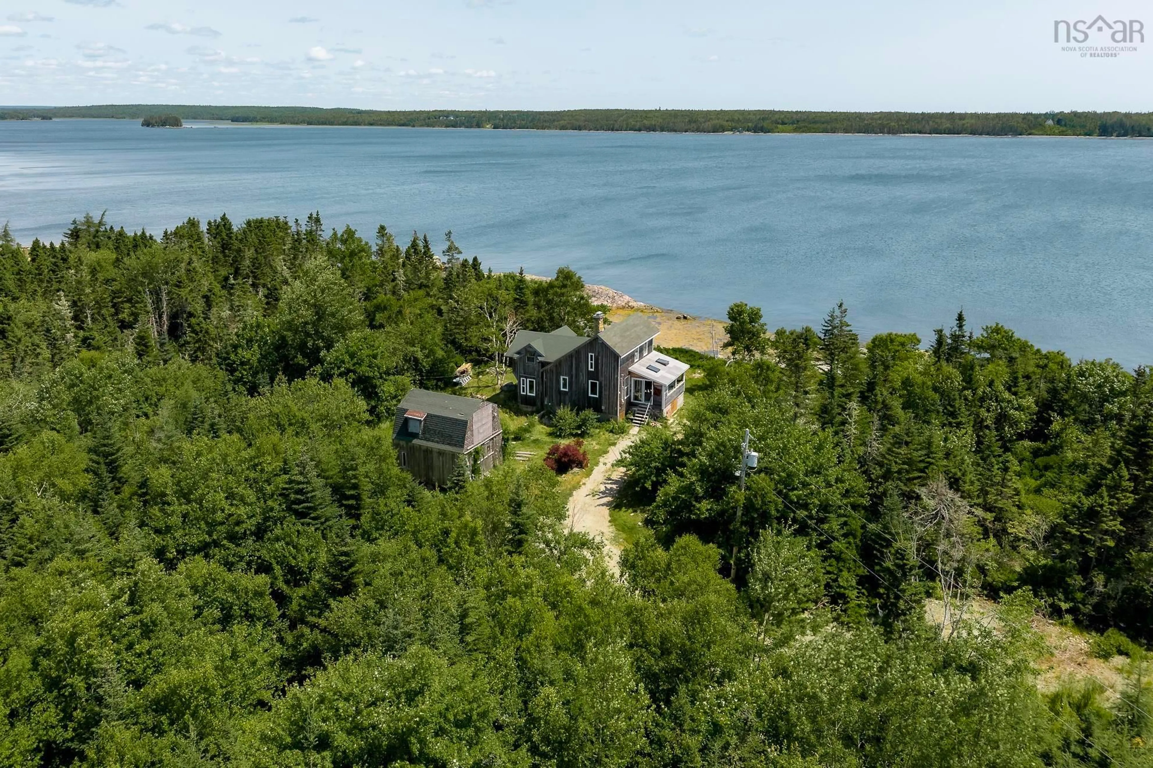 A pic from outside/outdoor area/front of a property/back of a property/a pic from drone, water/lake/river/ocean view for 121 Pleasant Point Rd, Osborne Harbour Nova Scotia B0T 1L0