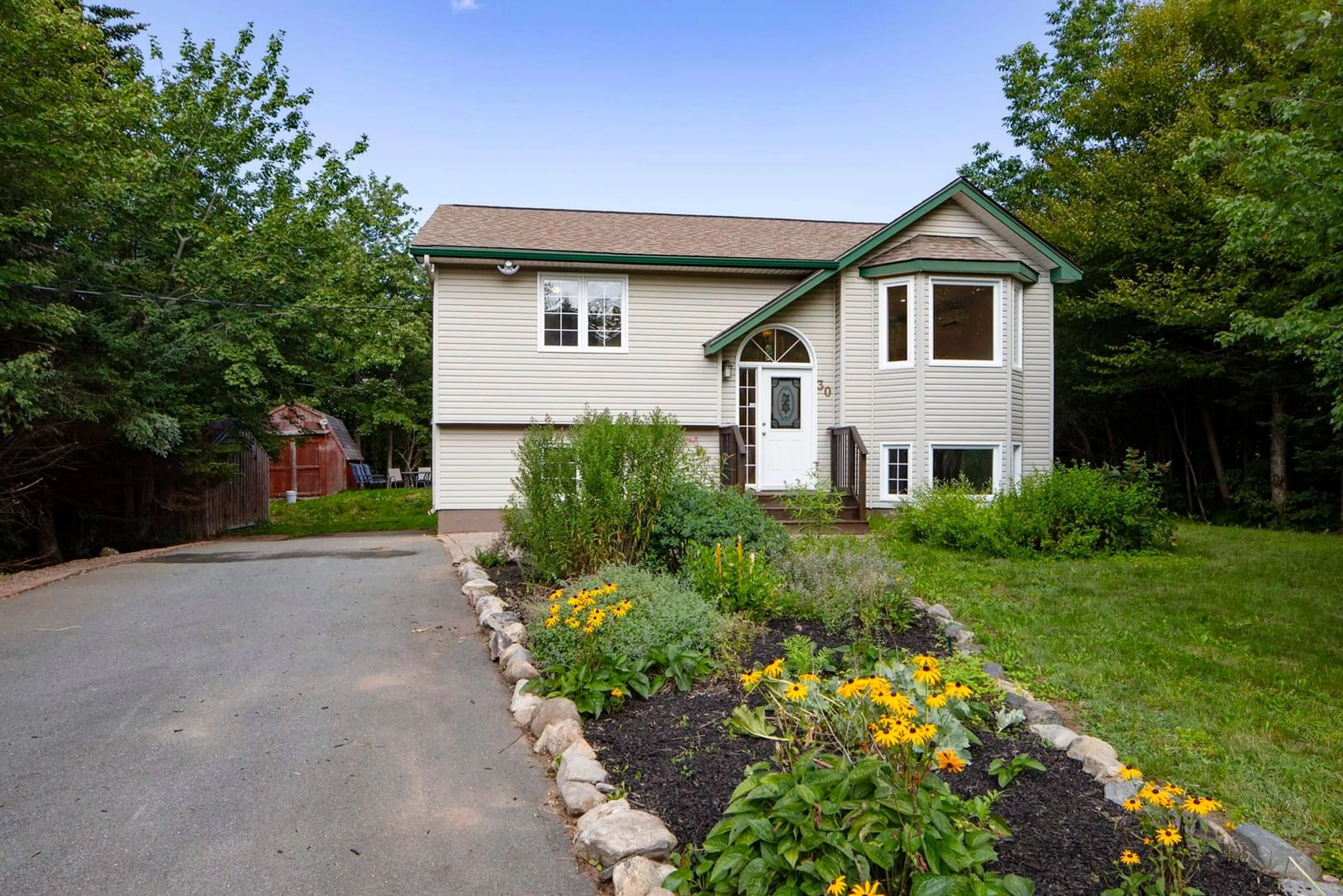 Home with vinyl exterior material, street for 30 Dyke Rd, Cow Bay Nova Scotia B3G 1K2