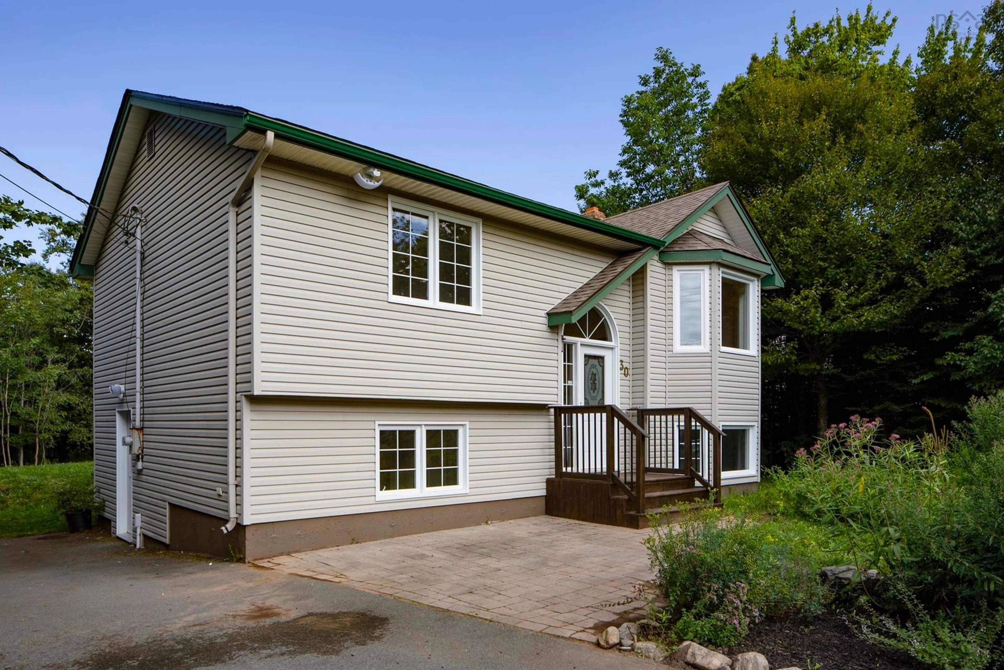 Home with vinyl exterior material, street for 30 Dyke Rd, Cow Bay Nova Scotia B3G 1K2