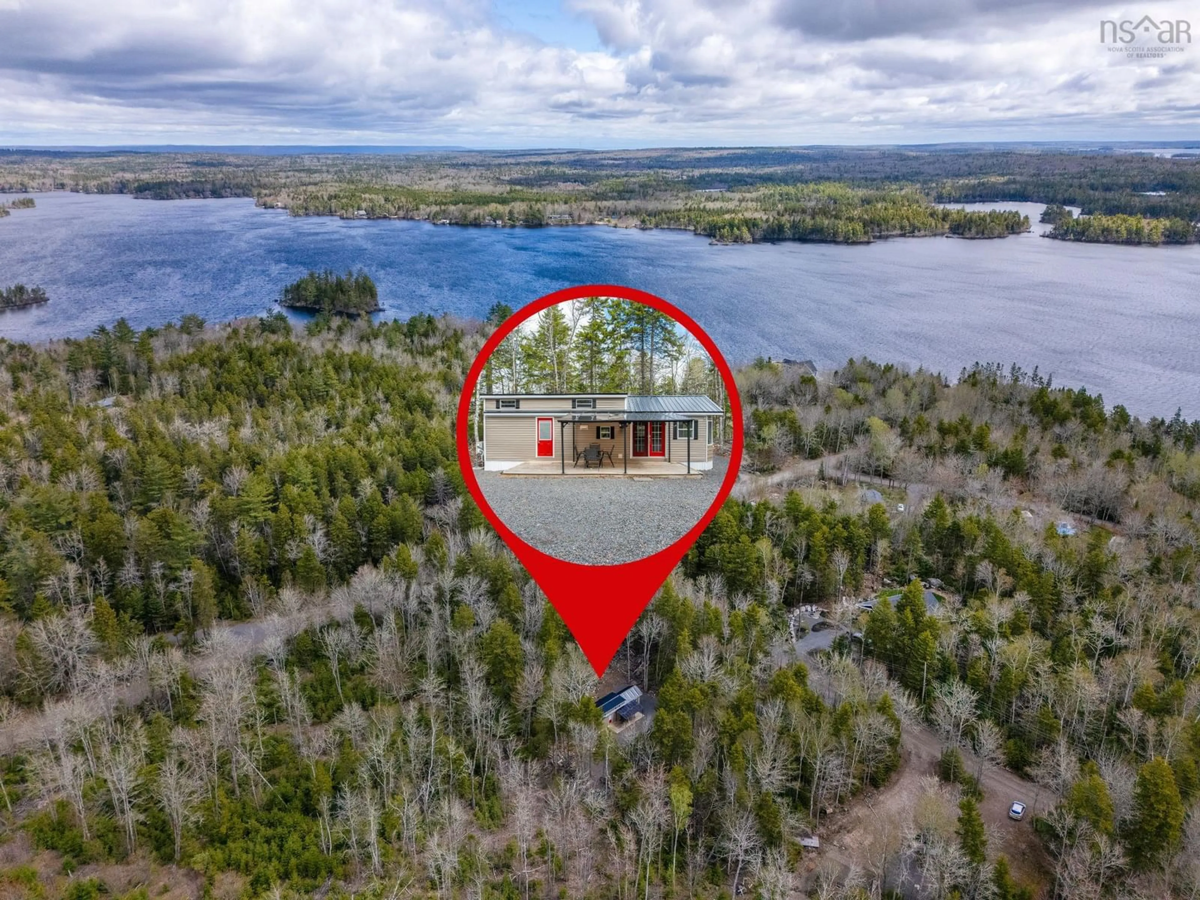 A pic from outside/outdoor area/front of a property/back of a property/a pic from drone, water/lake/river/ocean view for 18 Loon Lane, Aylesford Lake Nova Scotia B0P 1C0