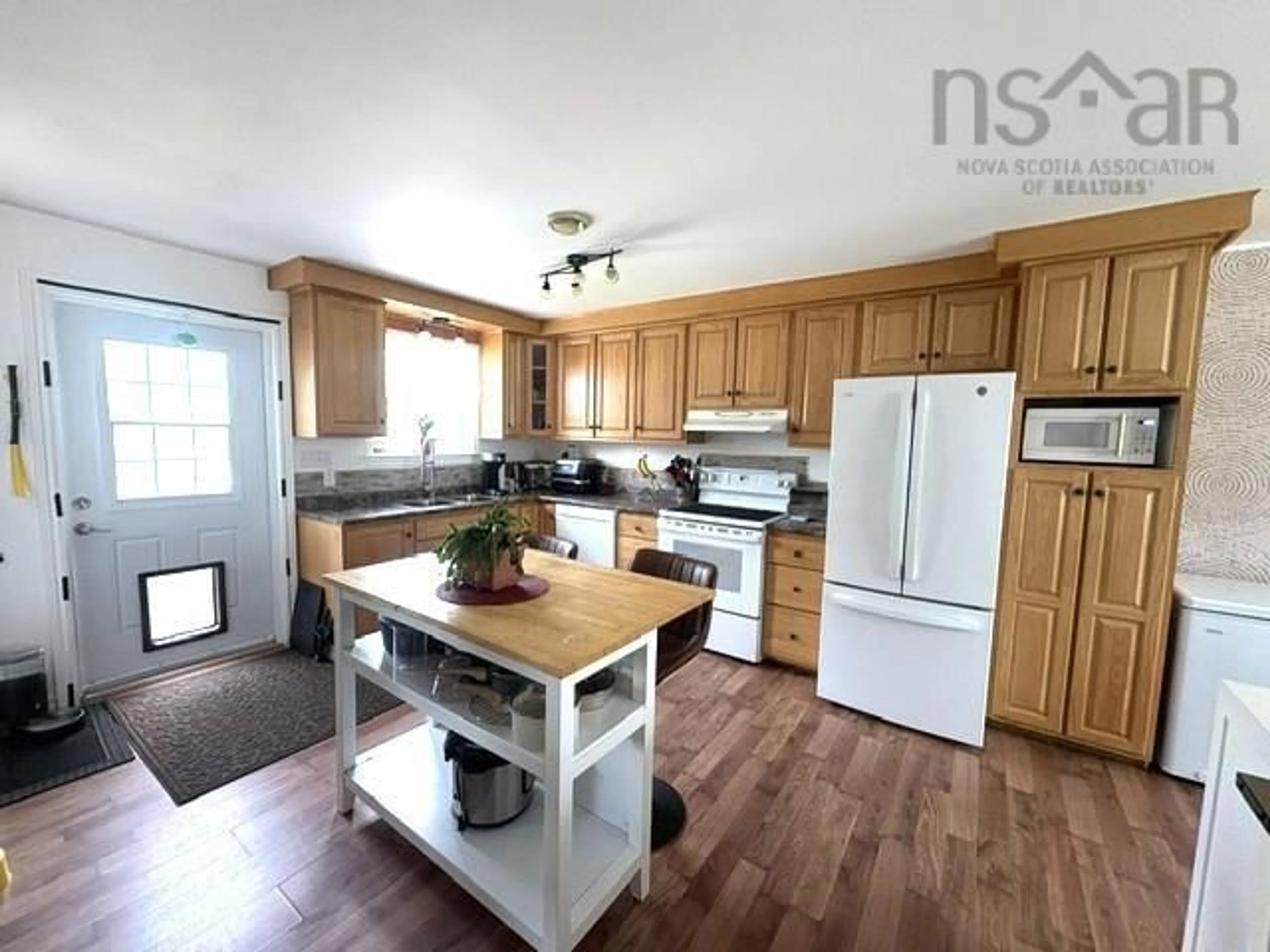Open concept kitchen, wood/laminate floor for 205 Clements St, Shelburne Nova Scotia B0T 1W0