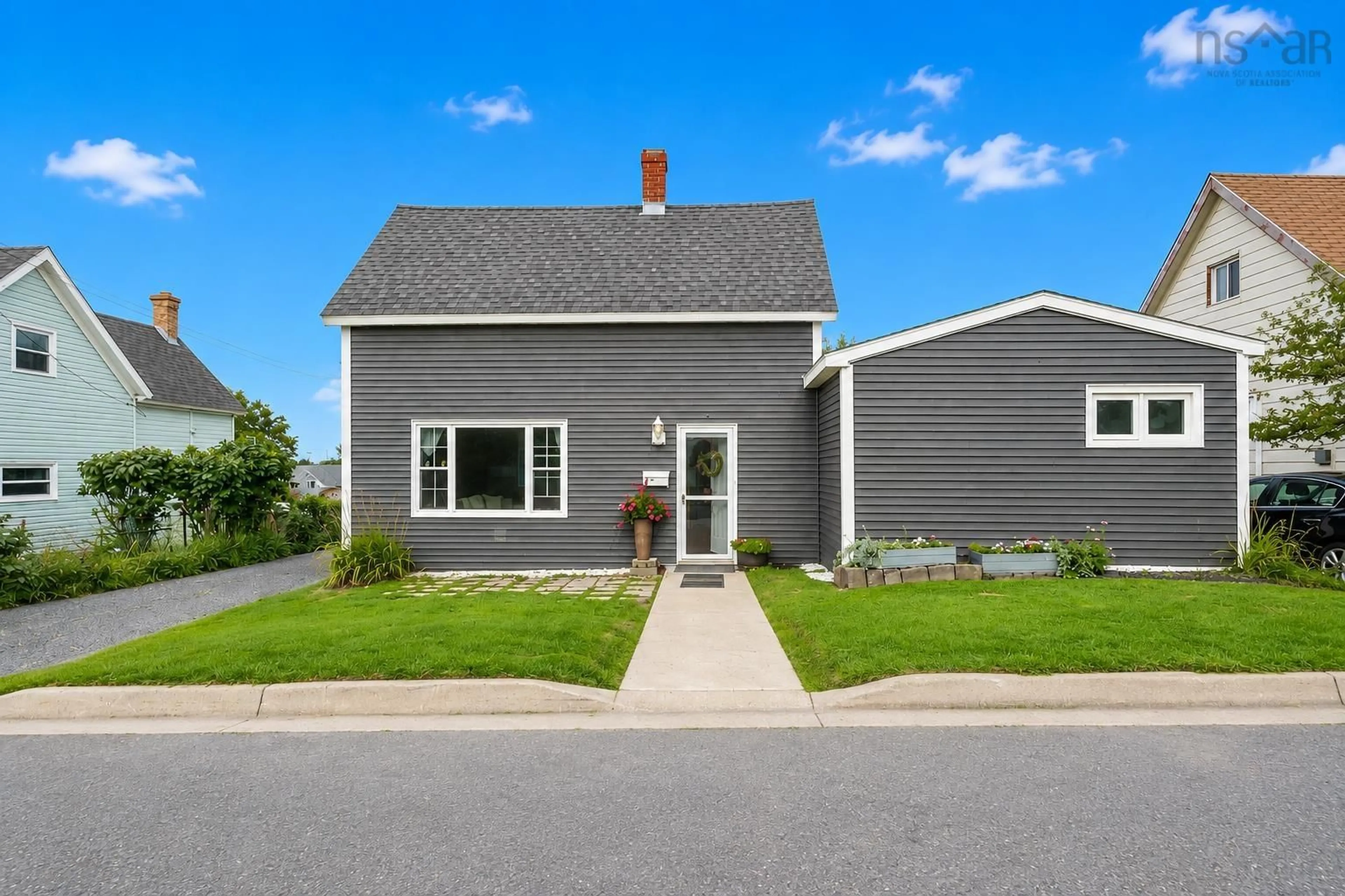 Home with vinyl exterior material, street for 10 Cottage St, Sydney Mines Nova Scotia B1V 2N4