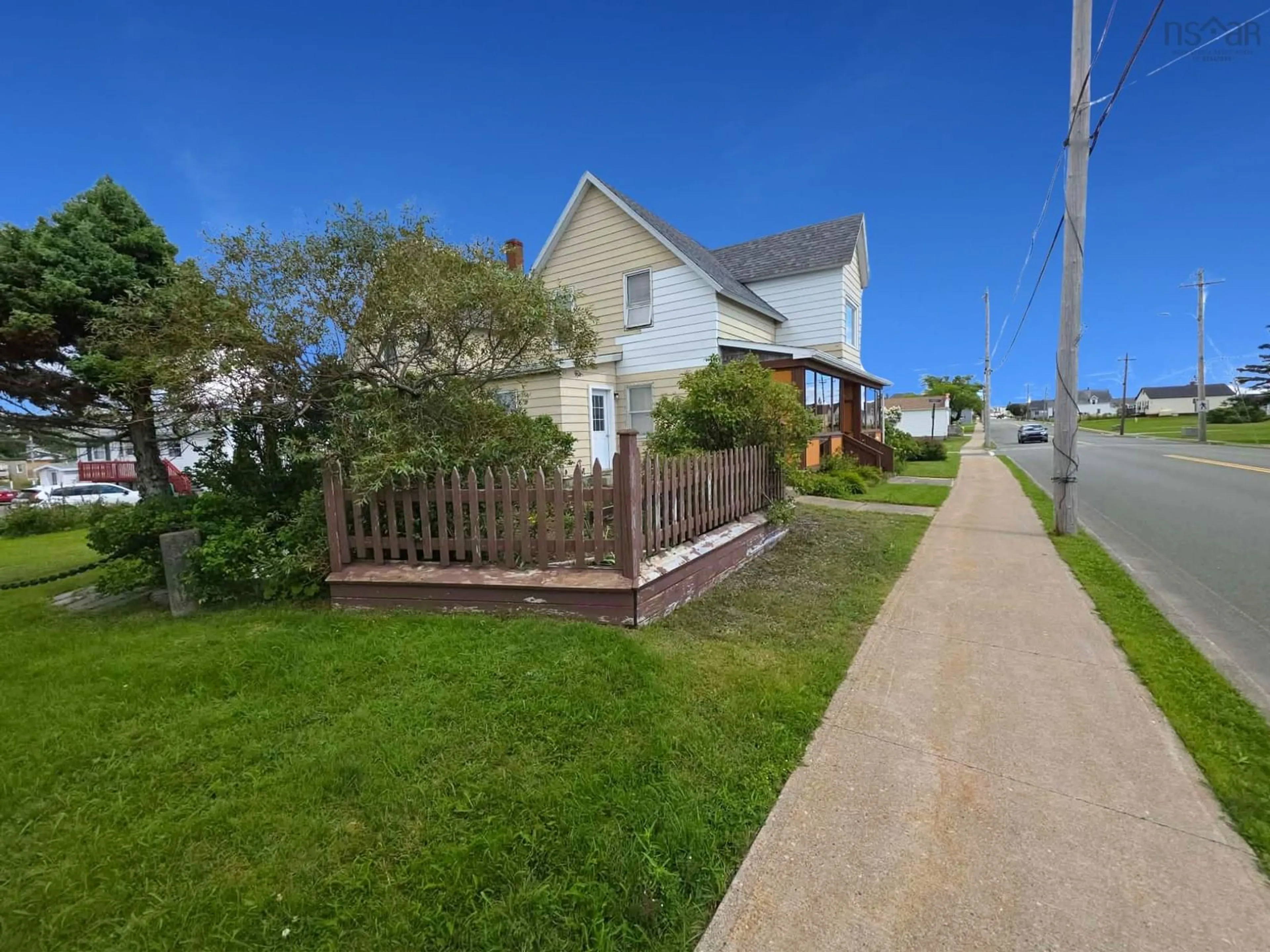 A pic from outside/outdoor area/front of a property/back of a property/a pic from drone, street for 7590 Main St, Louisbourg Nova Scotia B1C 2J8