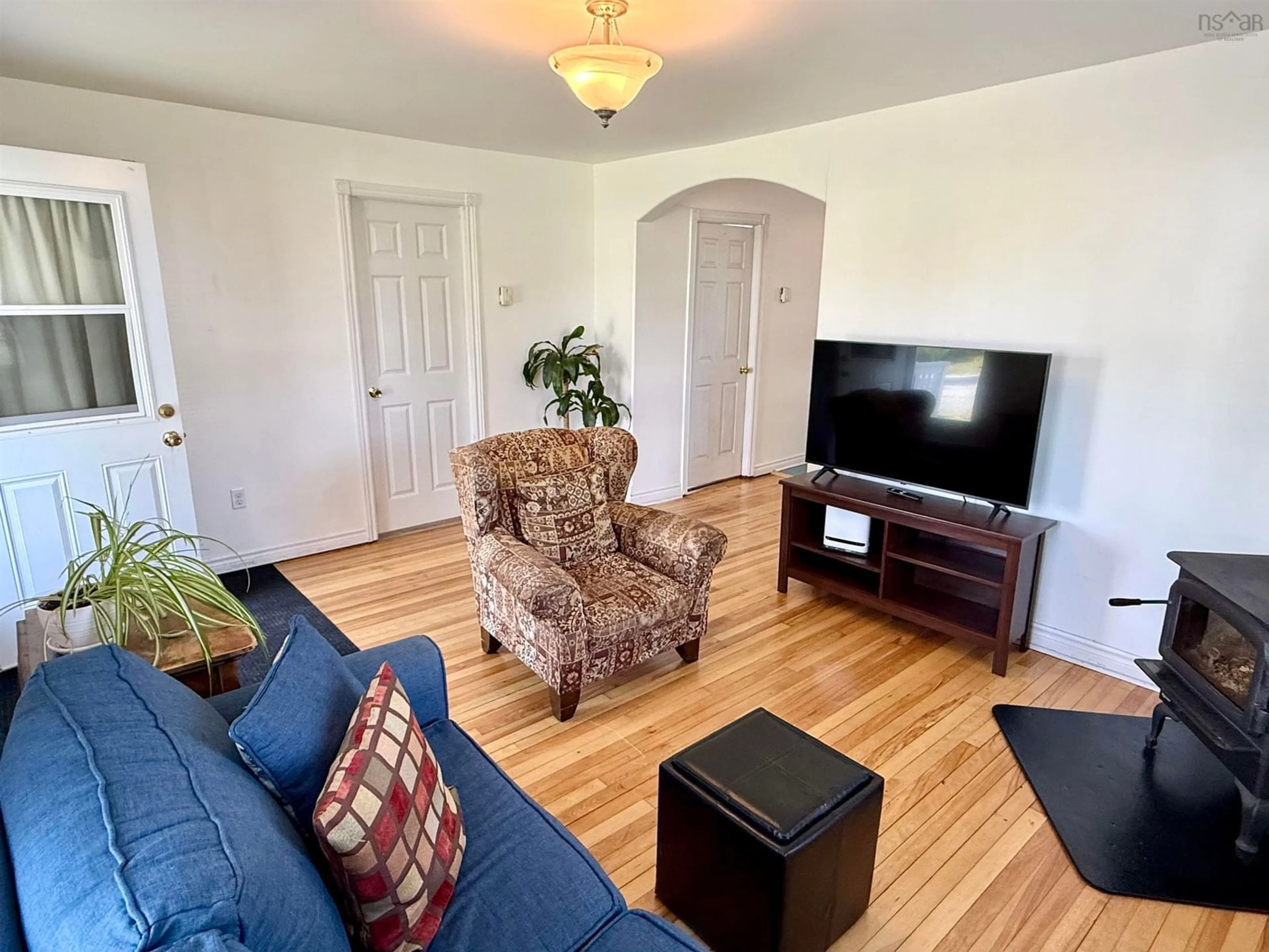 Living room with furniture, wood/laminate floor for 57 Cedar St, Pictou Nova Scotia B0K 1H0