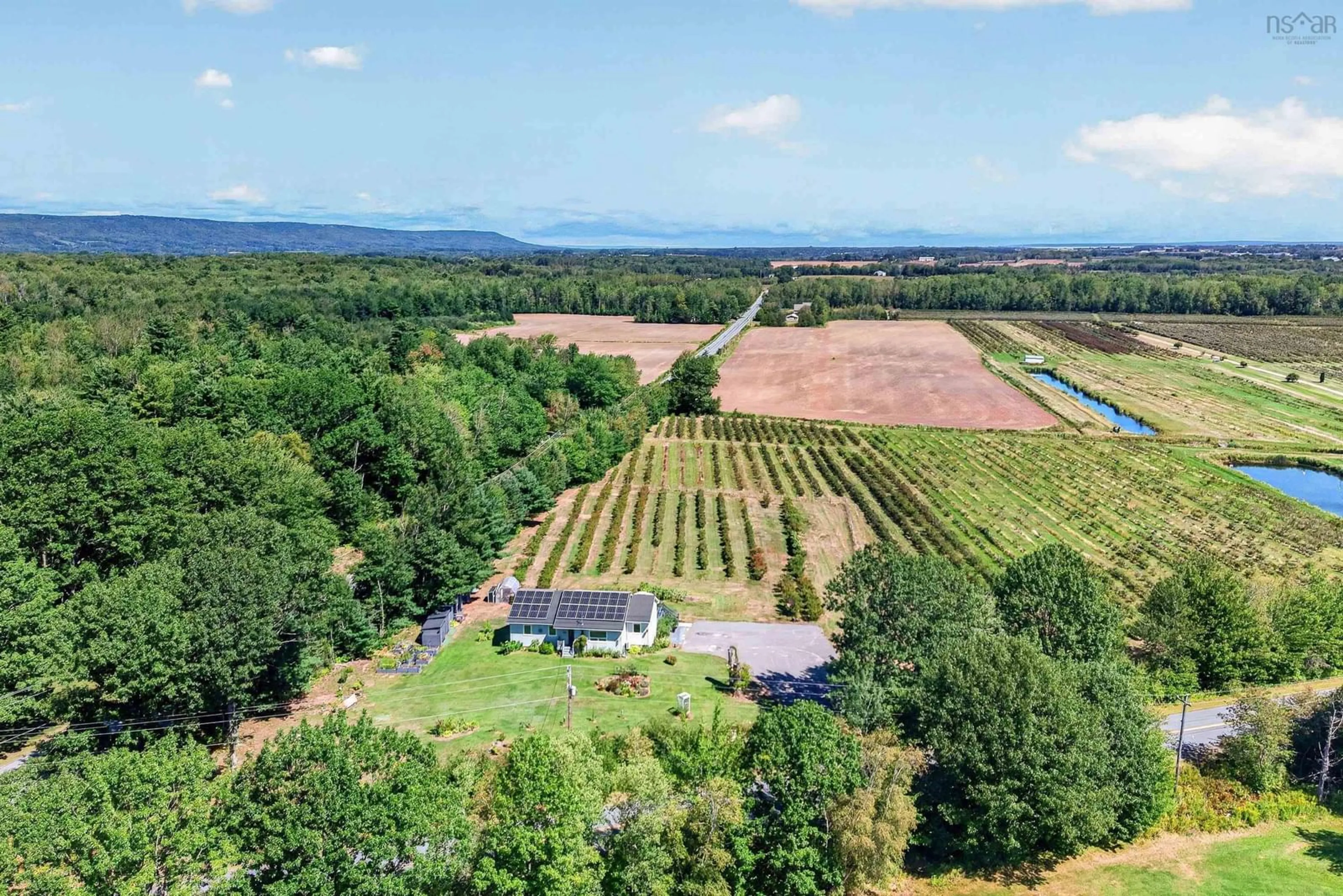 A pic from outside/outdoor area/front of a property/back of a property/a pic from drone, unknown for 1235 Sherman Belcher Rd, Centreville Nova Scotia B0P 1J0