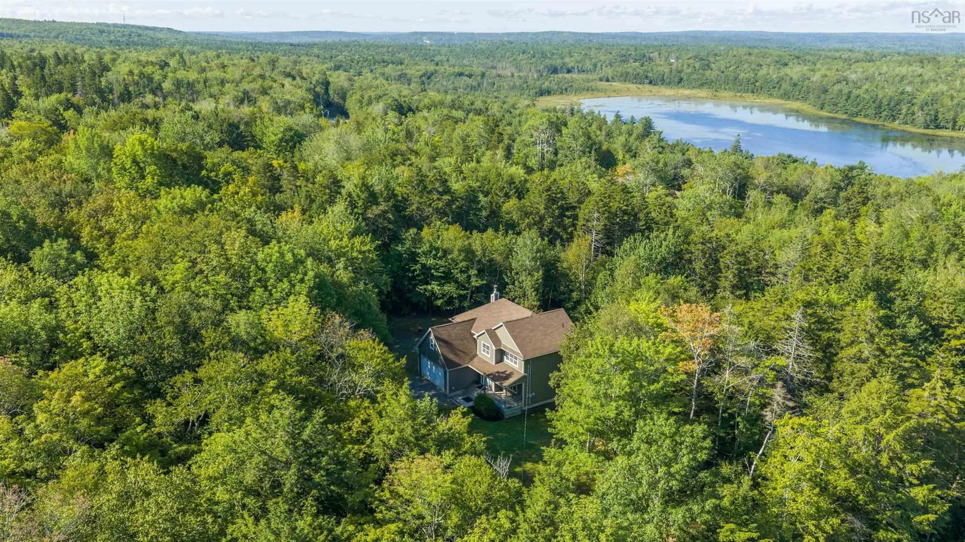 A pic from outside/outdoor area/front of a property/back of a property/a pic from drone, water/lake/river/ocean view for 25 Hartland Dr, Grand Lake Nova Scotia B2T 1B5