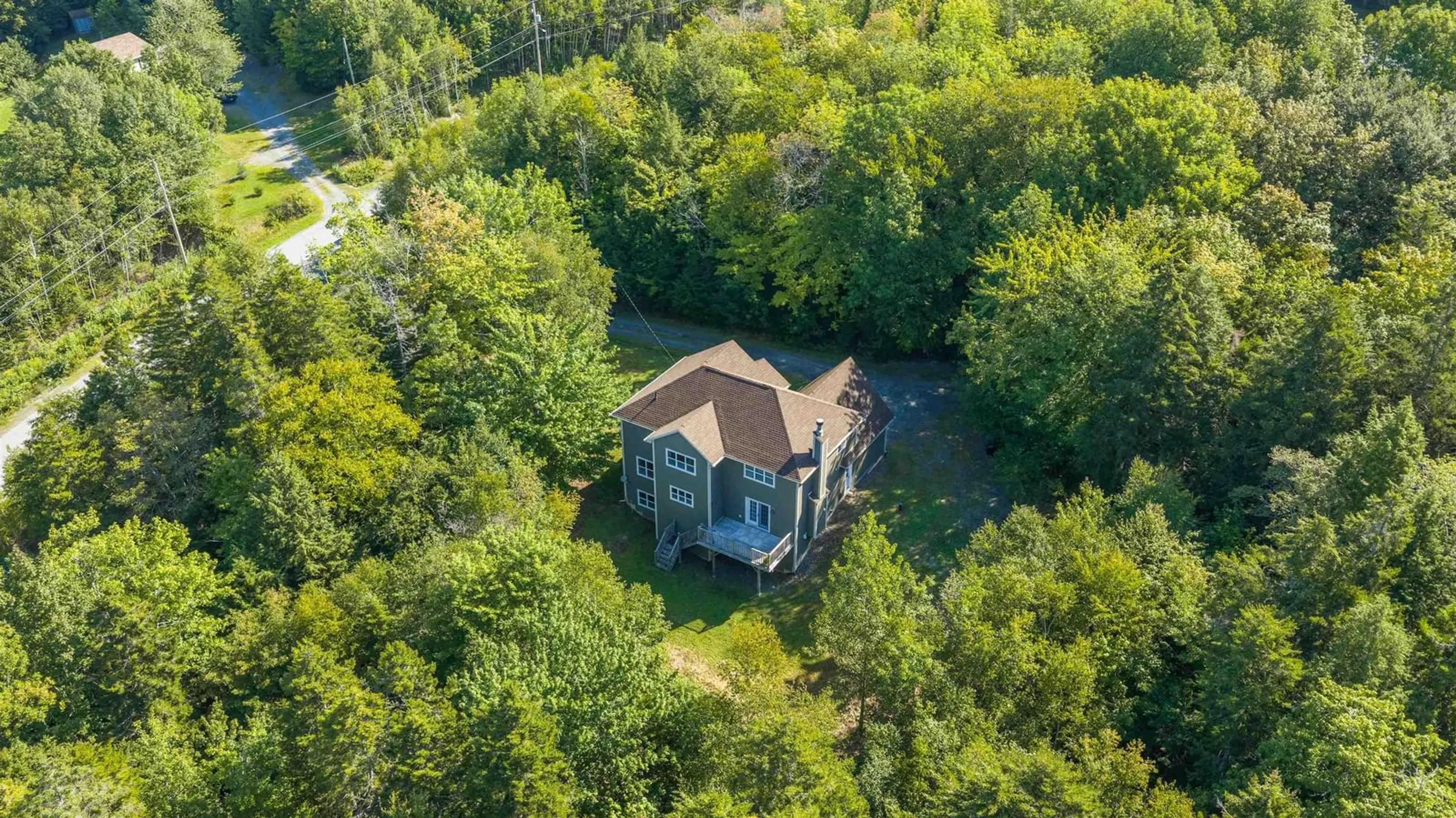 A pic from outside/outdoor area/front of a property/back of a property/a pic from drone, forest/trees view for 25 Hartland Dr, Grand Lake Nova Scotia B2T 1B5