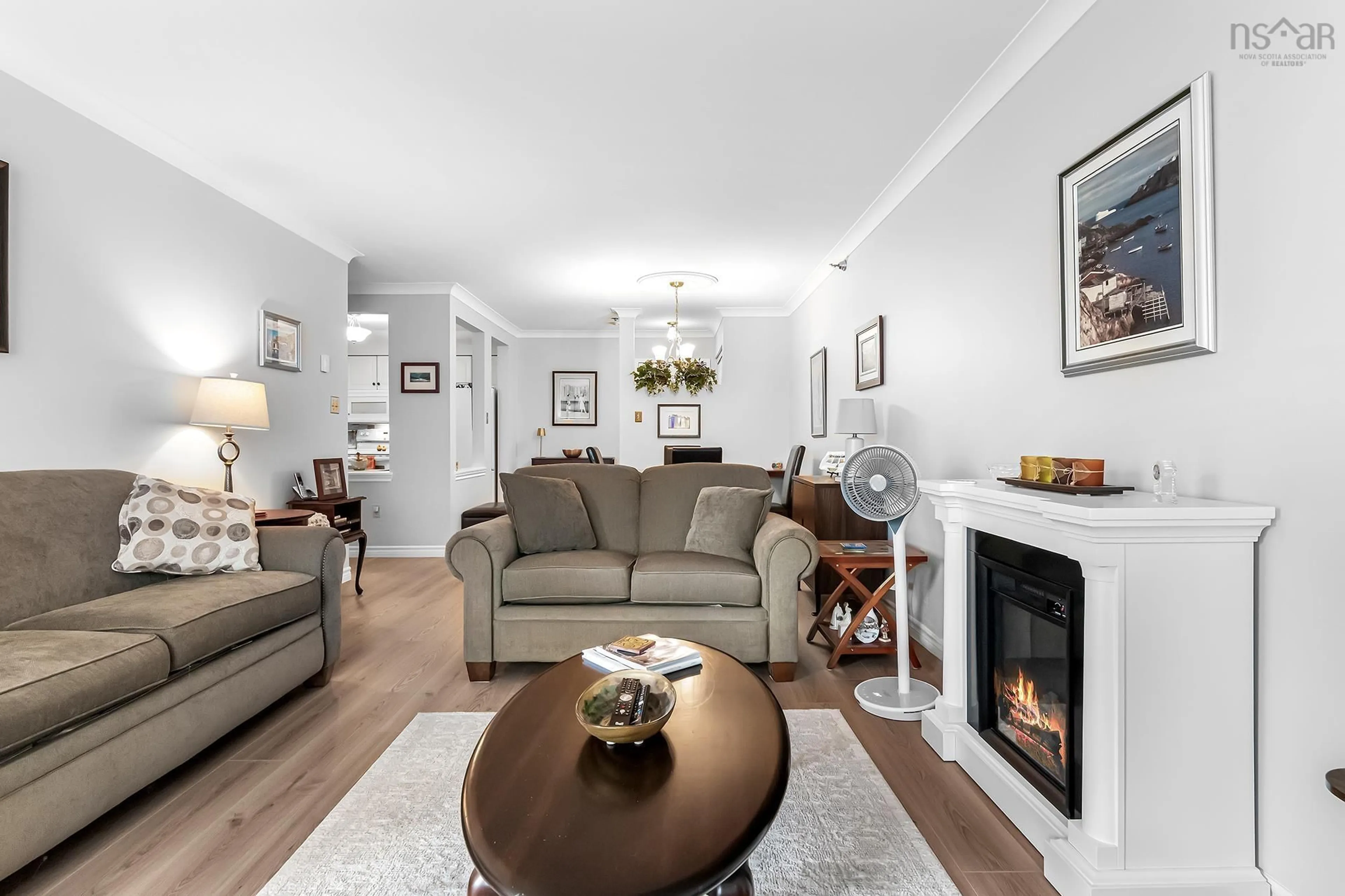 Living room with furniture, wood/laminate floor for 93 Kearney Lake Rd #308, Halifax Nova Scotia B3M 4B7