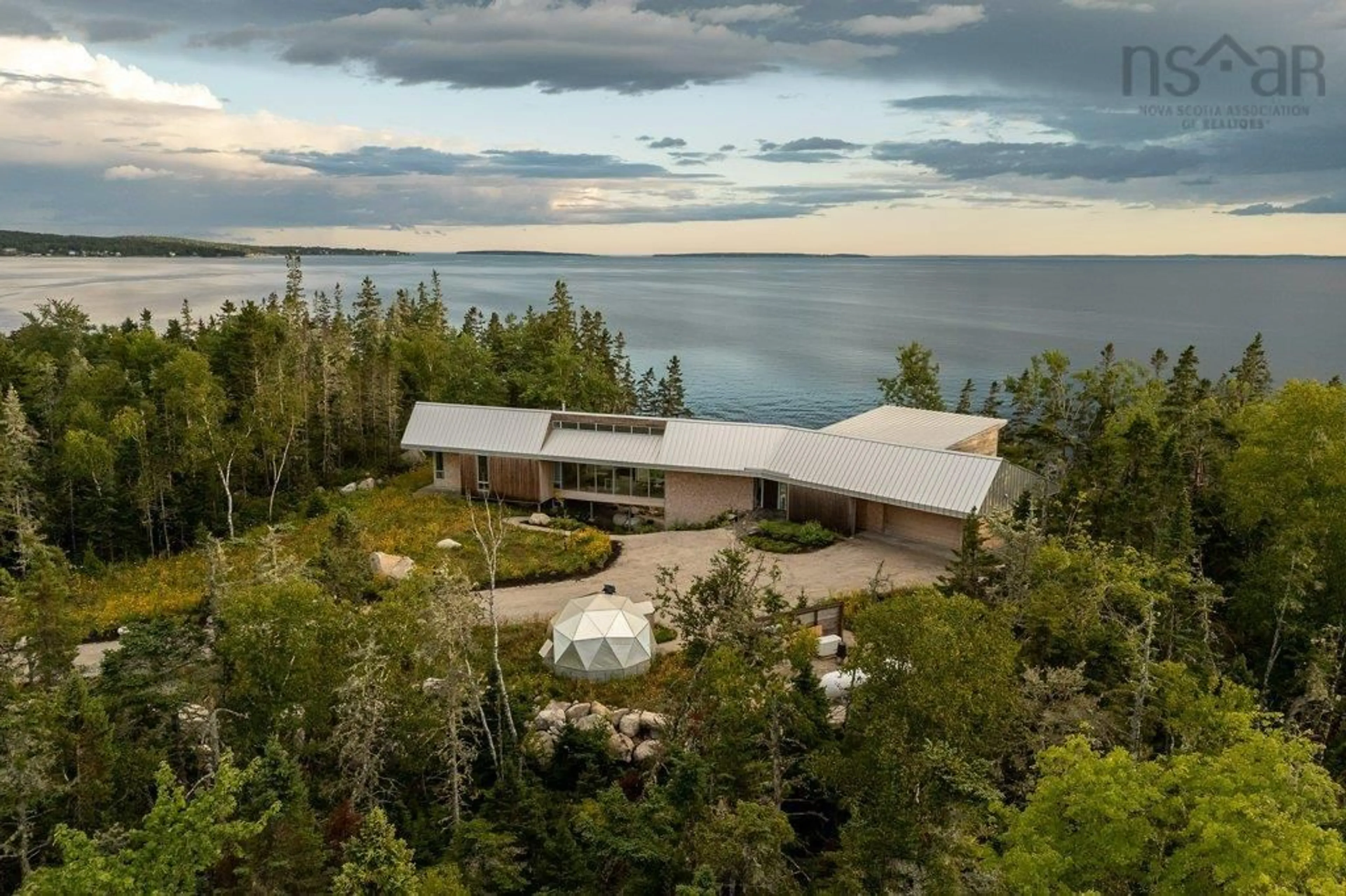 A pic from outside/outdoor area/front of a property/back of a property/a pic from drone, water/lake/river/ocean view for 6949 Highway 329, East River Point Nova Scotia B0J 1T0