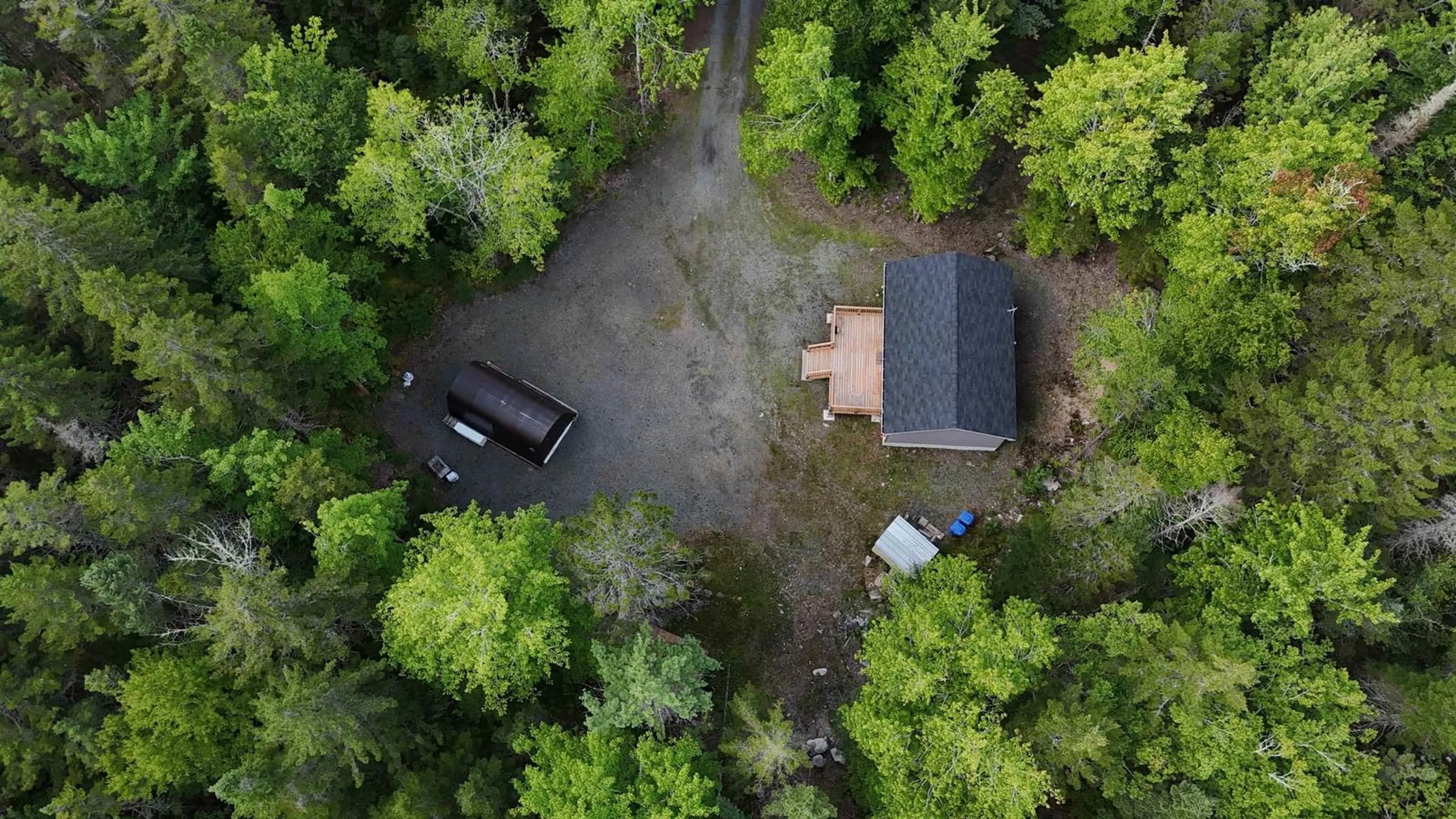 A pic from outside/outdoor area/front of a property/back of a property/a pic from drone, forest/trees view for 66 Shore Rd, Walden Nova Scotia B0J 2E0