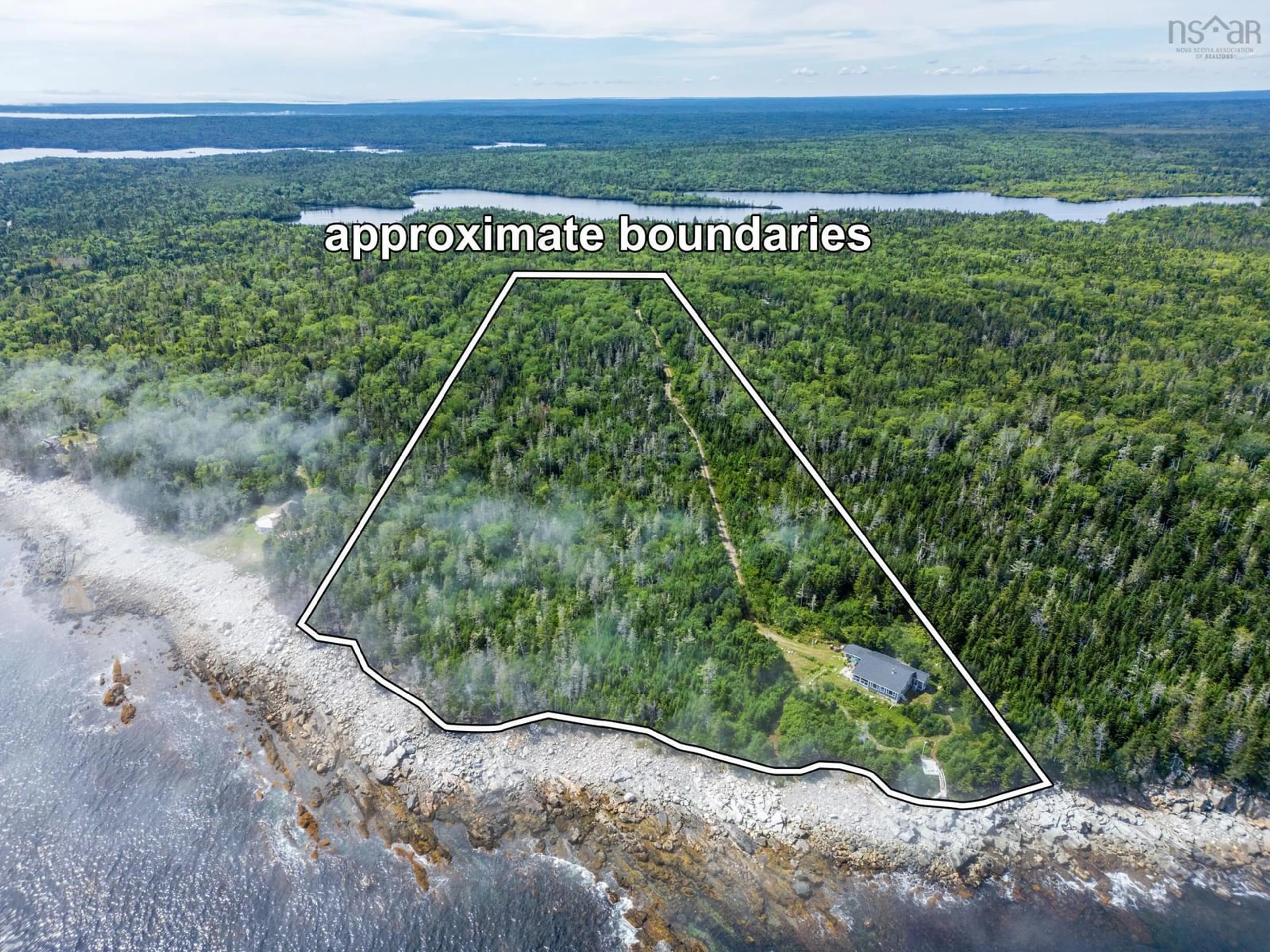 A pic from outside/outdoor area/front of a property/back of a property/a pic from drone, water/lake/river/ocean view for 1642 Mcleans Lake Rd, Port L'Hebert Nova Scotia B0T 1V0