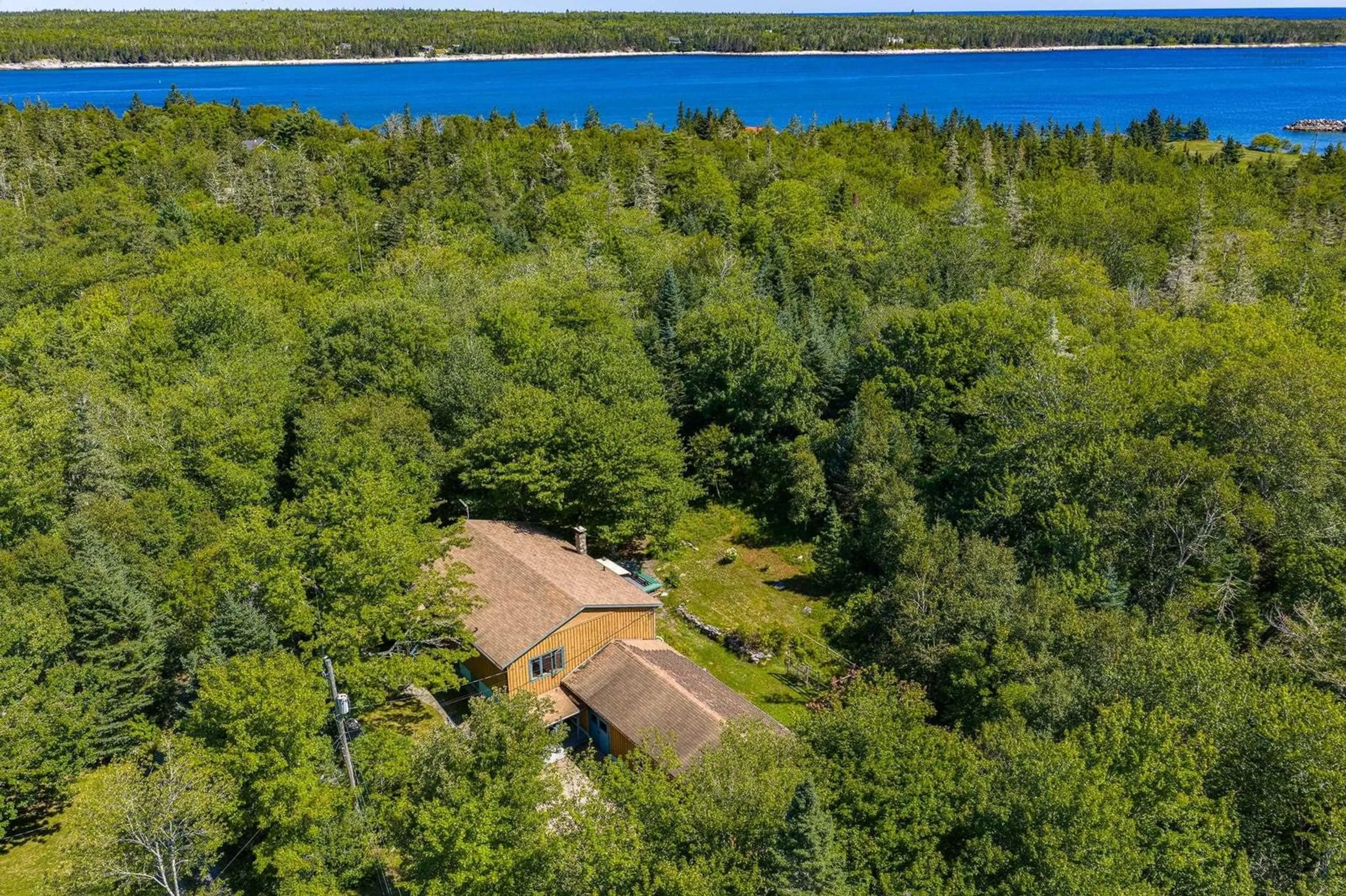 A pic from outside/outdoor area/front of a property/back of a property/a pic from drone, water/lake/river/ocean view for 10 River Rd, Port L'Hebert Nova Scotia B0T 1V0