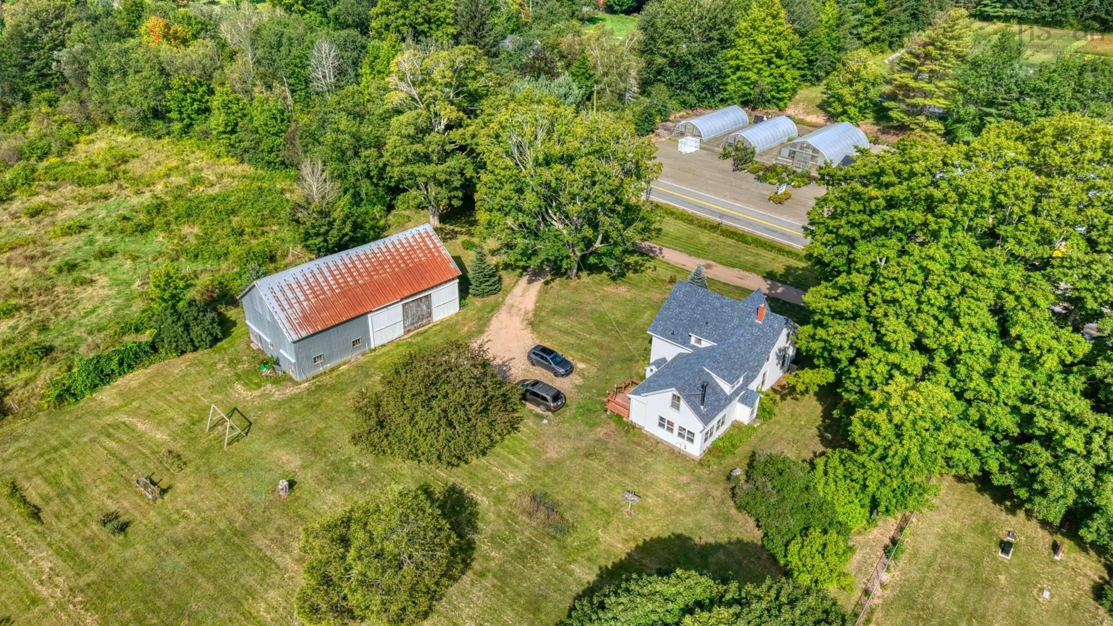A pic from outside/outdoor area/front of a property/back of a property/a pic from drone, unknown for 10136 Highway 1, Paradise Nova Scotia B0S 1R0