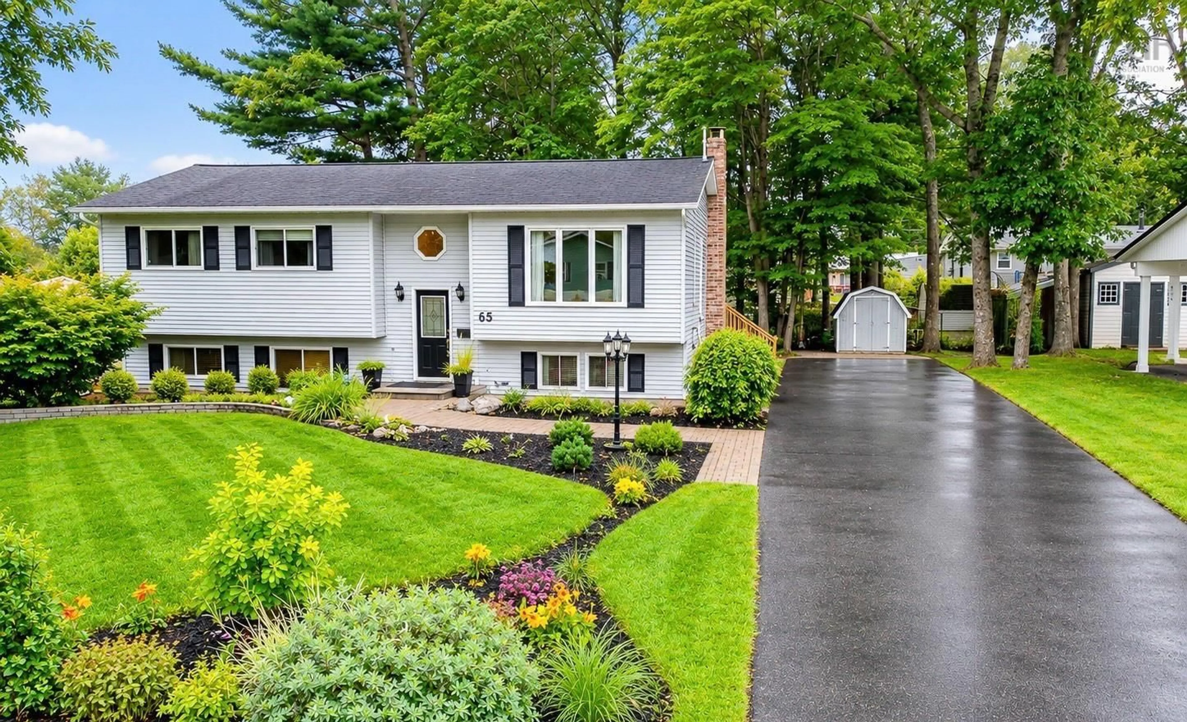 Home with vinyl exterior material, street for 65 Hirtle Dr, Bridgewater Nova Scotia B4V 3N9