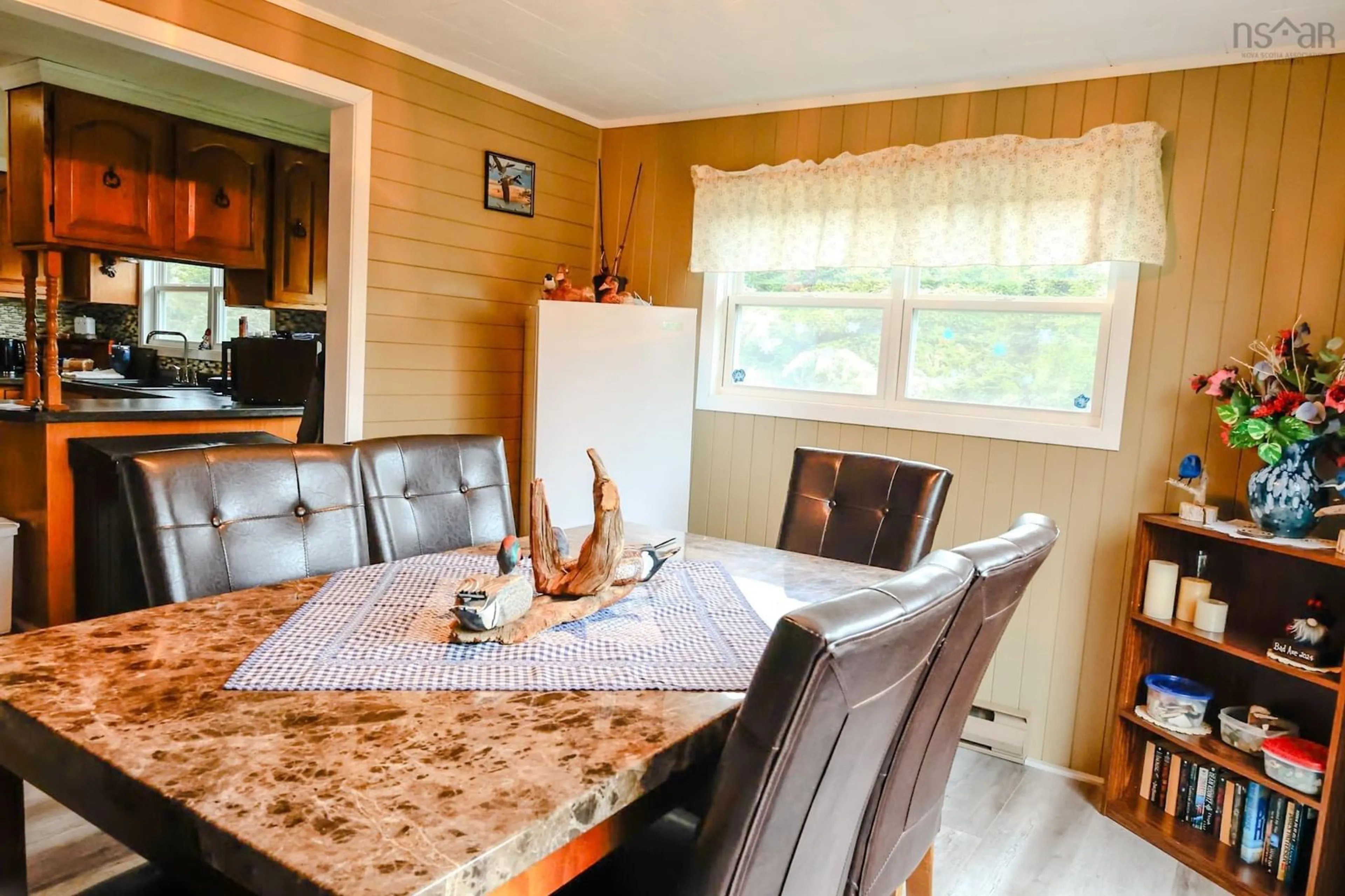 Dining room, wood/laminate floor for 28 Penney Rd, South Side Nova Scotia B0W 1P0