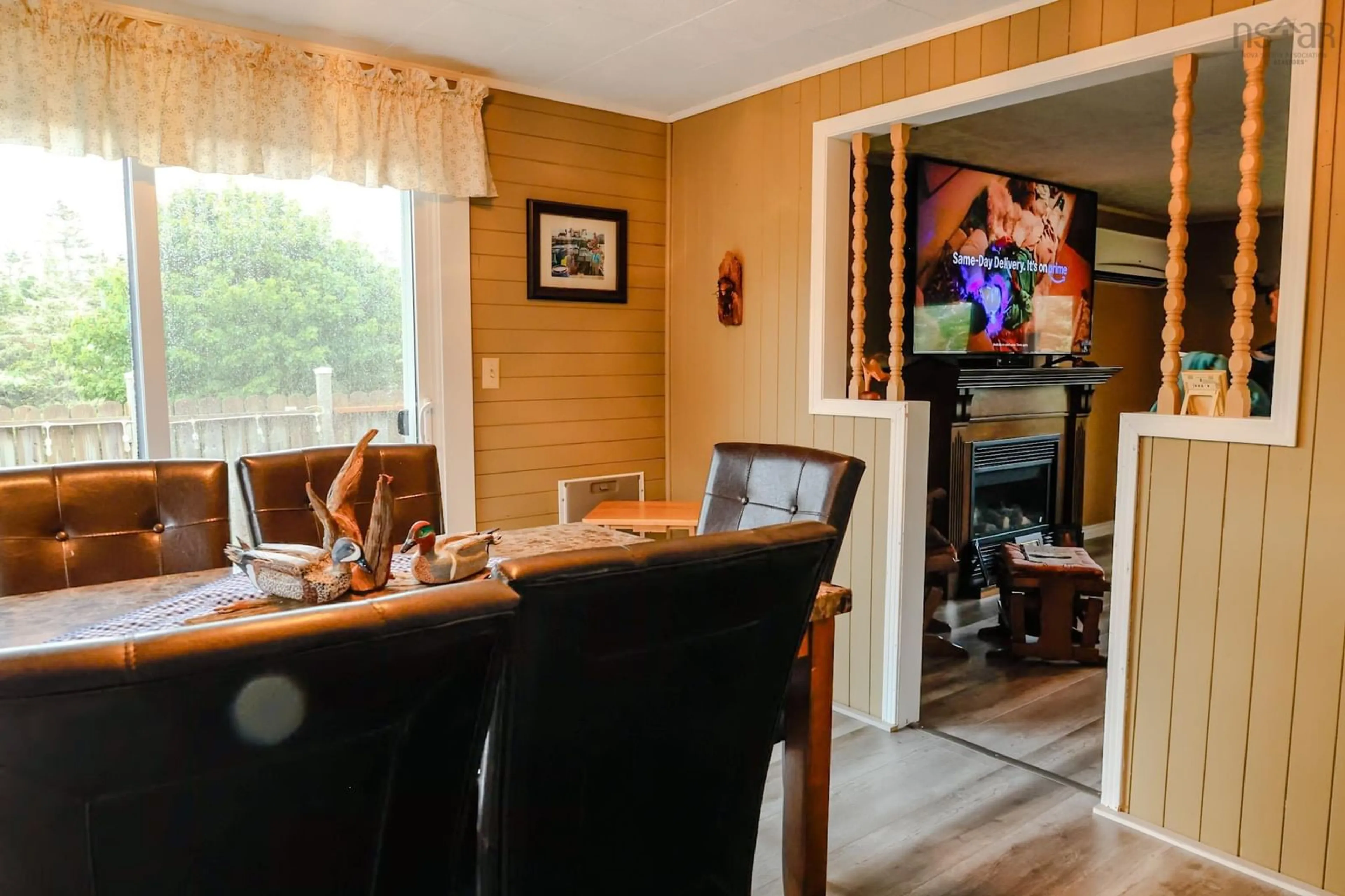 Dining room, wood/laminate floor for 28 Penney Rd, South Side Nova Scotia B0W 1P0
