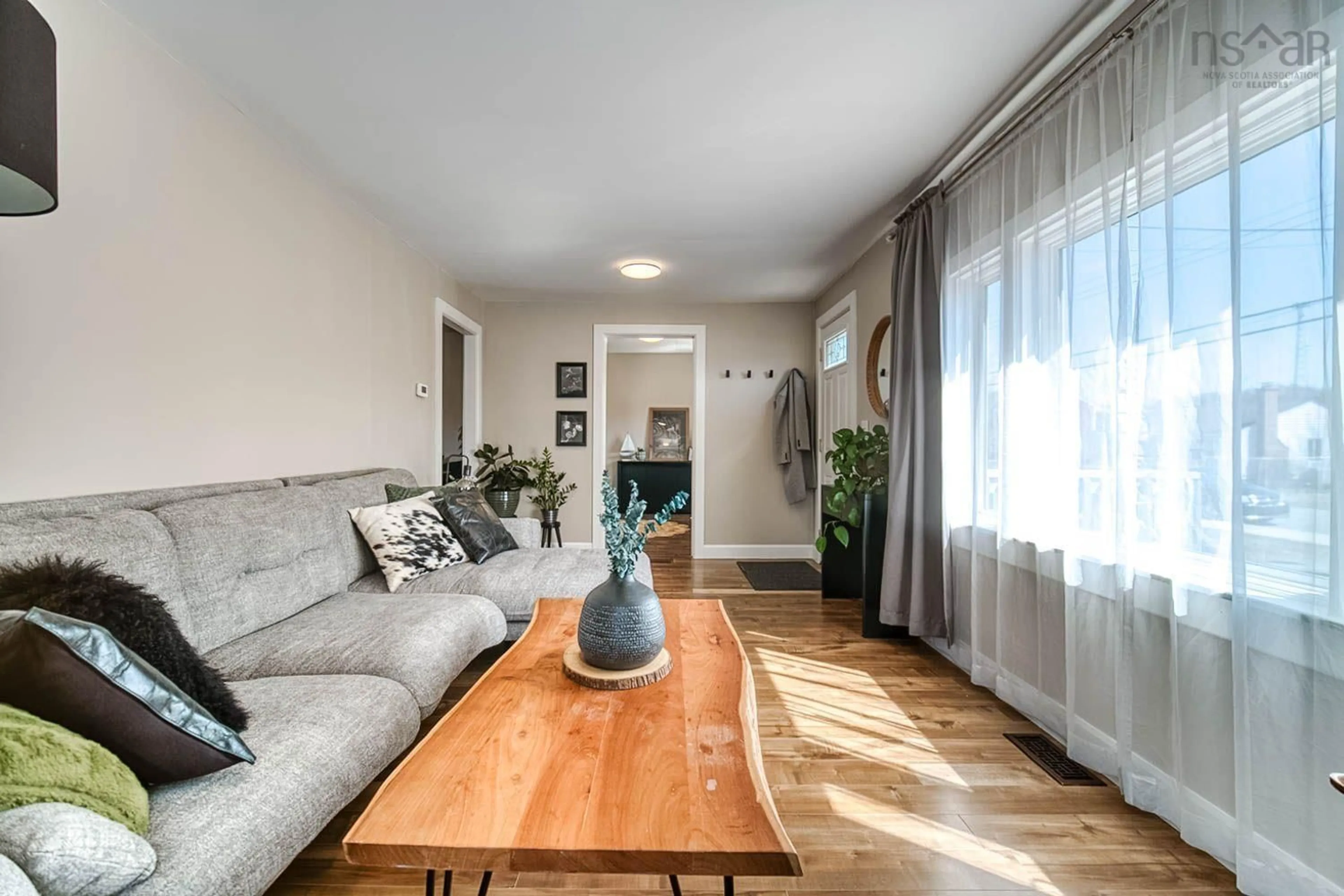 Living room with furniture, wood/laminate floor for 331 Chadwick St, Dartmouth Nova Scotia B2Y 2M2