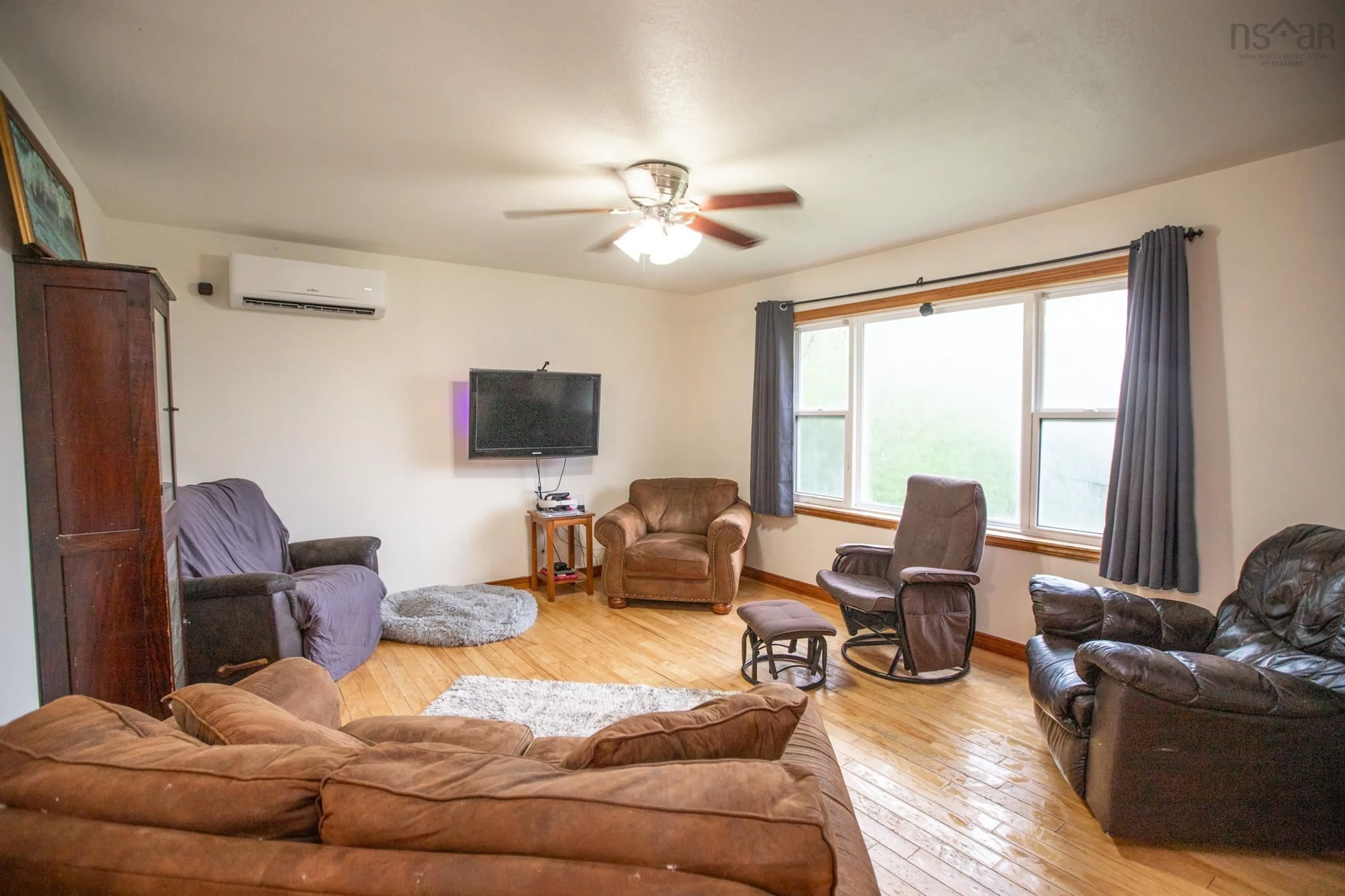 Living room with furniture, wood/laminate floor for 58 Delmerle Dr, Whites Lake Nova Scotia B3T 1W9
