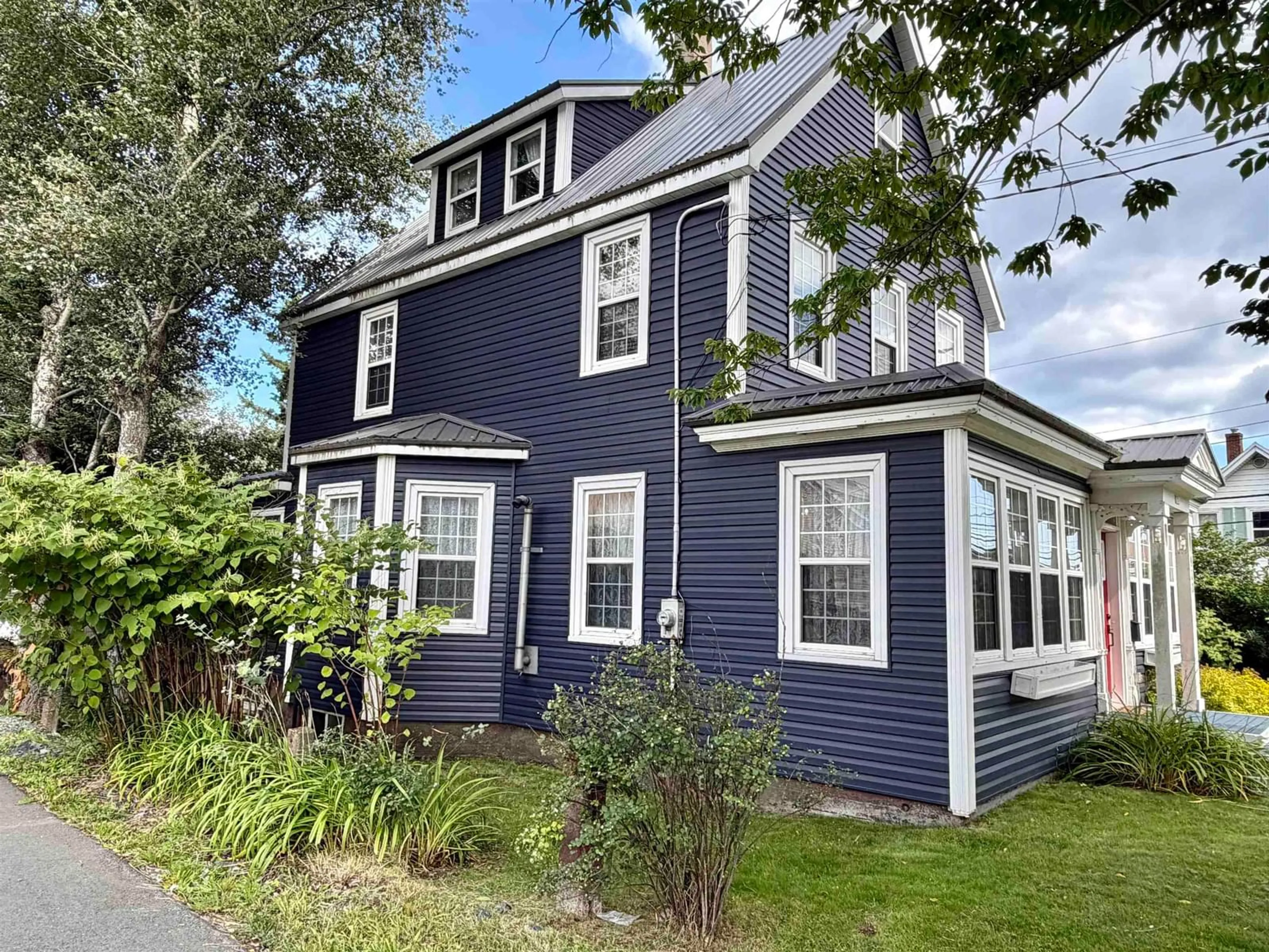 Home with vinyl exterior material, street for 830 Main St, Glace Bay Nova Scotia B1A 4Z4