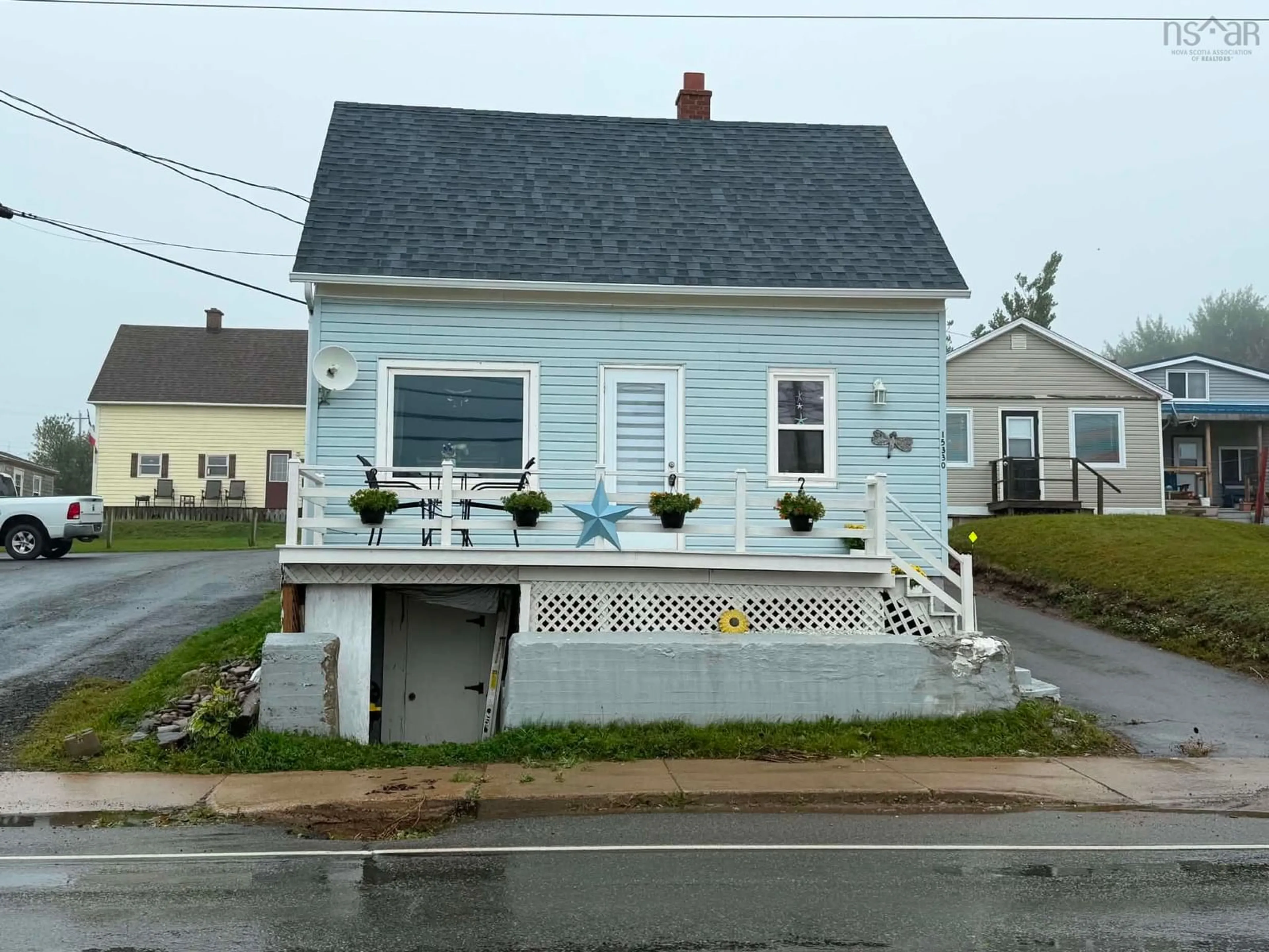 Home with vinyl exterior material, street for 15330 Cabot Trail, Chéticamp Nova Scotia B0E 1H0