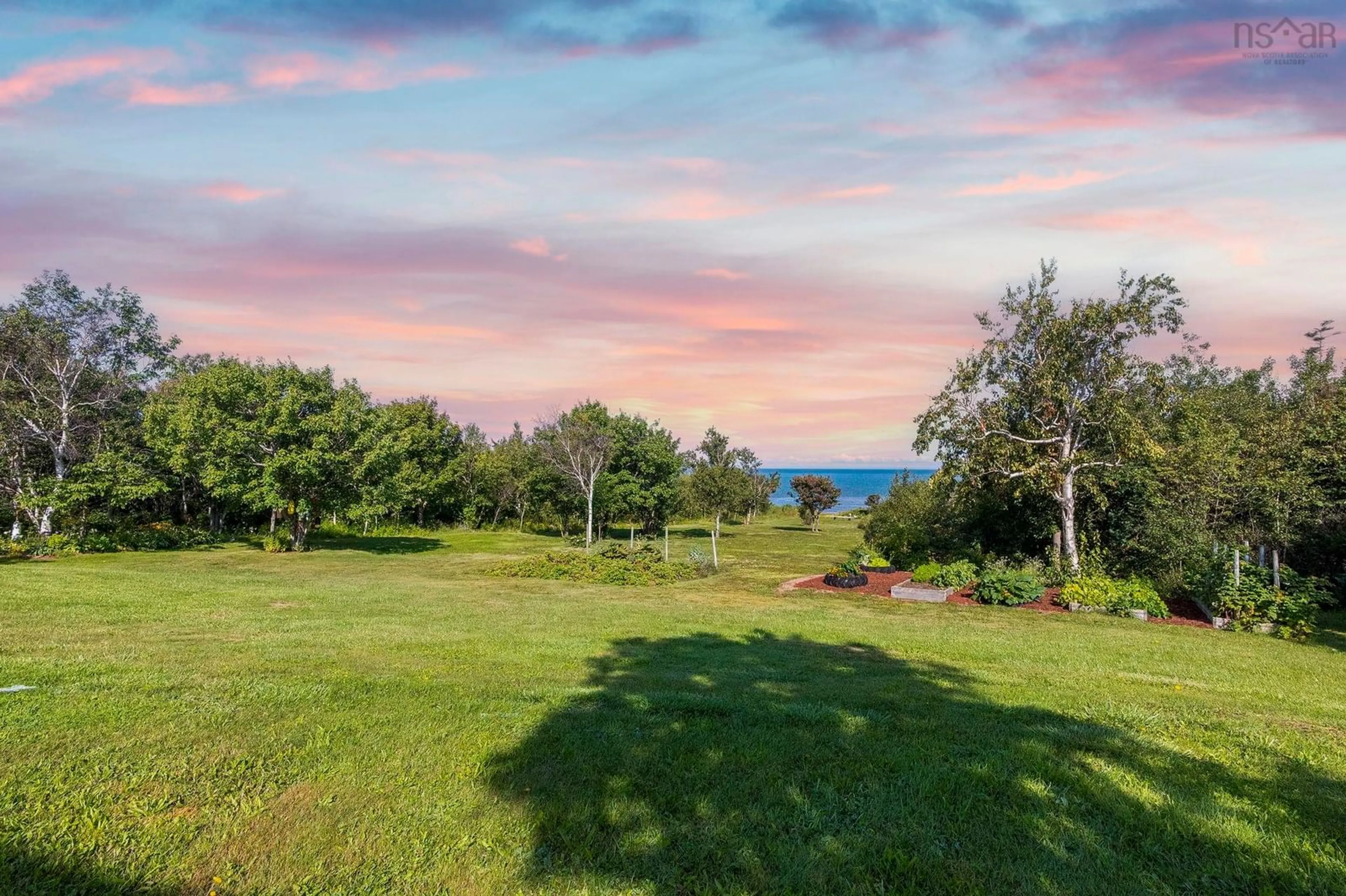 A pic from outside/outdoor area/front of a property/back of a property/a pic from drone, water/lake/river/ocean view for 6437 Shore Road West, Youngs Cove Nova Scotia B0S 1L0