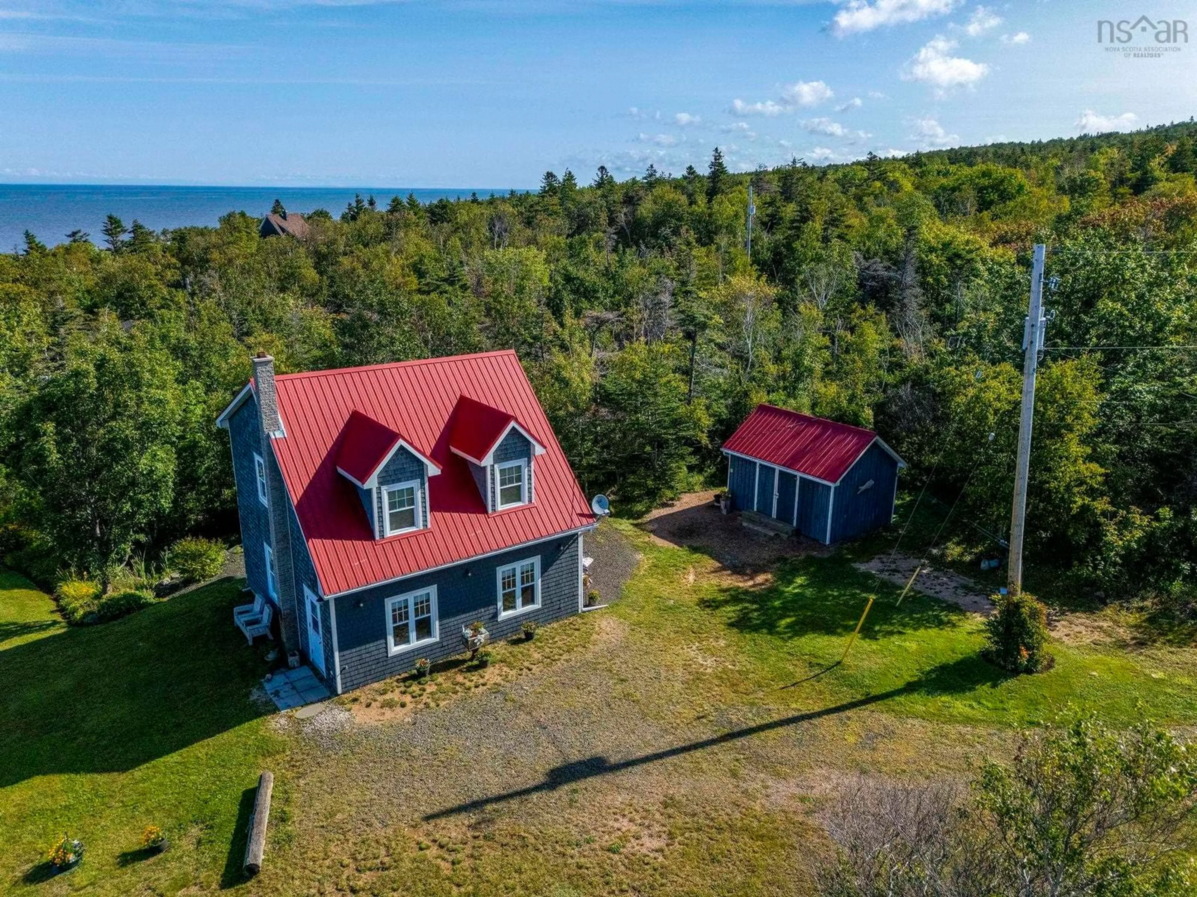 A pic from outside/outdoor area/front of a property/back of a property/a pic from drone, water/lake/river/ocean view for 6437 Shore Road West, Youngs Cove Nova Scotia B0S 1L0