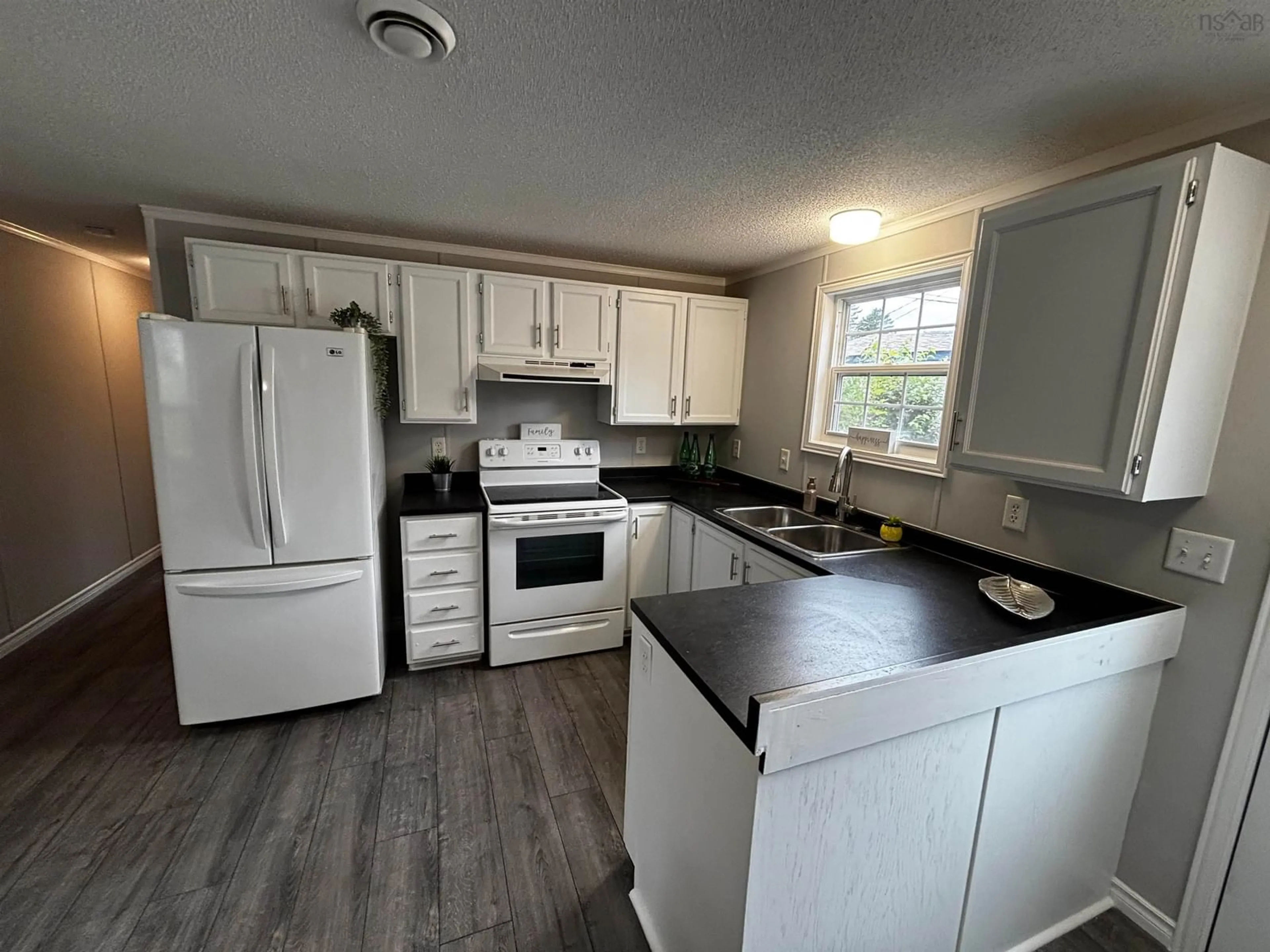 Standard kitchen, wood/laminate floor for 16 Happy Dr, Lake Echo Nova Scotia B3E 1C4