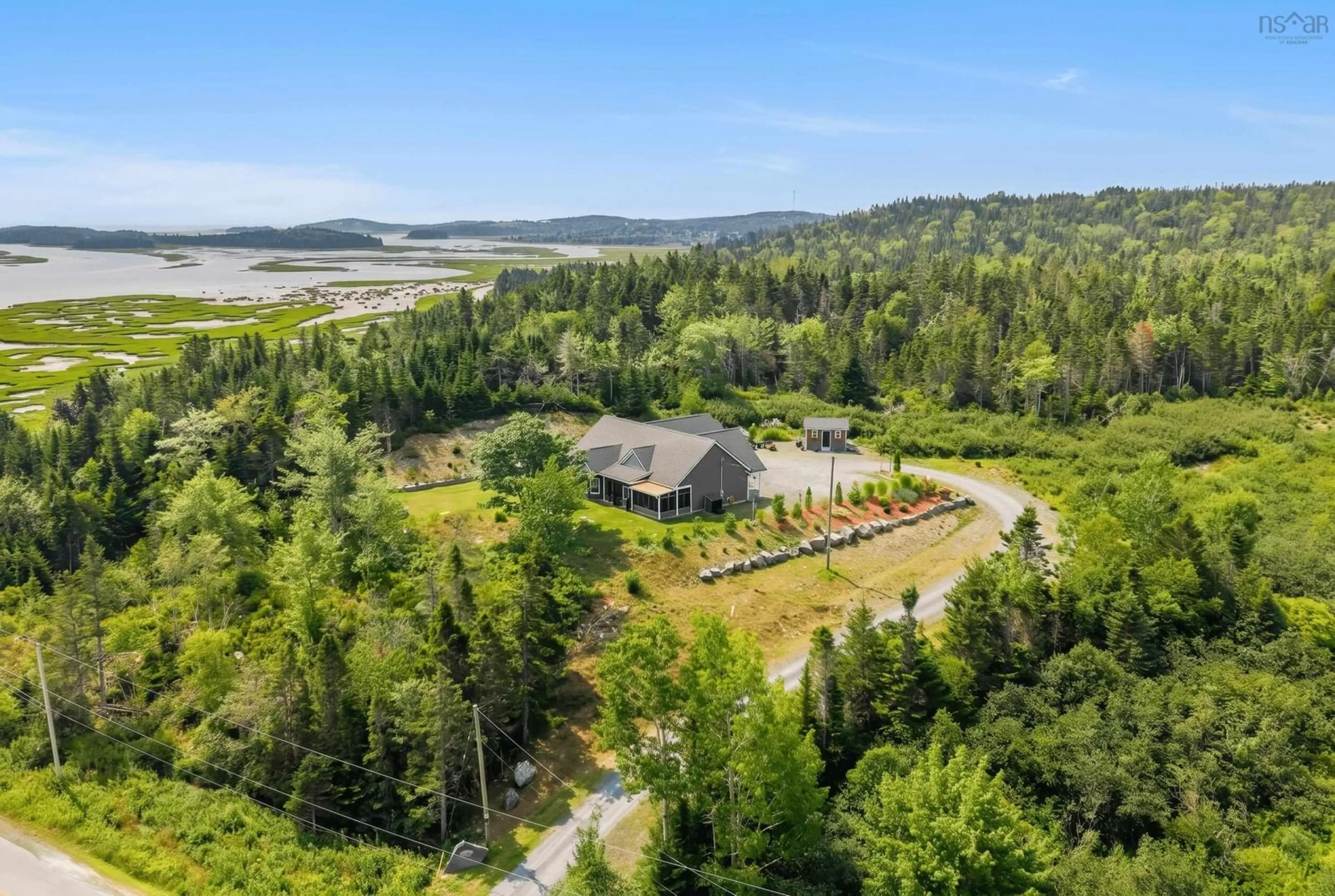 A pic from outside/outdoor area/front of a property/back of a property/a pic from drone, water/lake/river/ocean view for 395 Shore Rd, West Chezzetcook Nova Scotia B0J 2L0